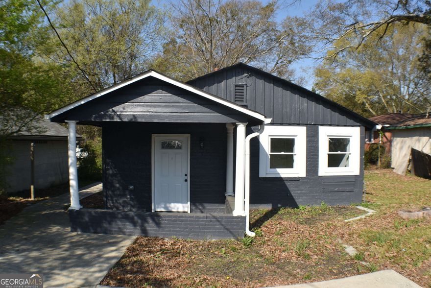 Great opportunity to own this cozy recently renovated home in Northwest Atlanta! Situated in a prime location, this property enjoys easy access to the bustling city life of Atlanta while still providing a tranquil residential ambiance of the very popular Collier Heights area. This 3BR/2BA residence boasts a classic color scheme, a covered front porch, and huge front yard for all of your outdoor activities. Originally built in 1950, the newly renovated property offers the appeal of mid-20th century design with lots of modern improvements. The interior offers beautiful laminate floors, a contemporary color palette, an open floorplan, bright white trim, and a large living room. The open concept kitchen features stainless-steel appliances, granite countertops, plenty of cabinetry, an electric range/oven, a built-in microwave, a dishwasher, an undermount sink with a stylish faucet, recessed lighting. Don't miss out on the opportunity to make this charming residence your new home. Schedule a showing today and experience the best of Atlanta living at 266 Hamilton E Holmes Dr NW. This property is being offered As-Is, no representations, disclosures, or warrantees.