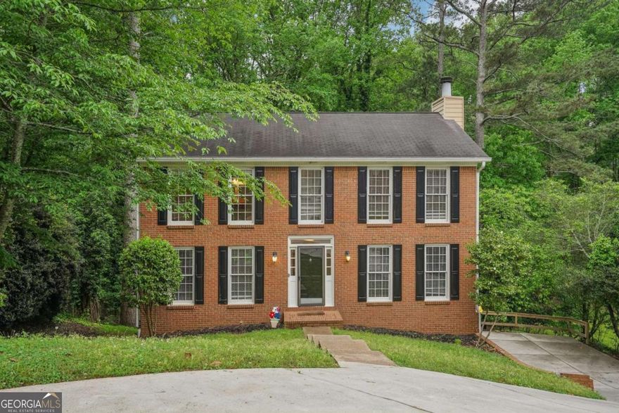 Welcome home to this charming brick front residence nestled in a highly desirable Alpharetta neighborhood! Featuring a welcoming entry foyer, the home opens into a spacious family room with a cozy brick fireplace Co perfect for gathering with family and friends. To the left of the foyer, the dining room flows seamlessly into a bright kitchen complete with an island and an eat-in breakfast area. Upstairs, you'll find the spacious primary bedroom featuring dual closets and a primary bath with double vanities and a walk-in shower. Two secondary bedrooms are located on the opposite side of the home, sharing a full bathroom. The partial finished basement offers flexible space ideal for a media room, home gym, or office, complete with a convenient half bath. Step outside to your private backyard oasis, which backs up to serene woods Co perfect for relaxing or entertaining on the spacious deck during cool summer evenings. Located within top-rated school districts and offering easy access to shopping, dining, parks, highways, and more, this home combines comfort with convenience. The owner is motivated to sell Co letCOs get you settled in before the summer holidays! Schedule your showing today and make this wonderful home yours!