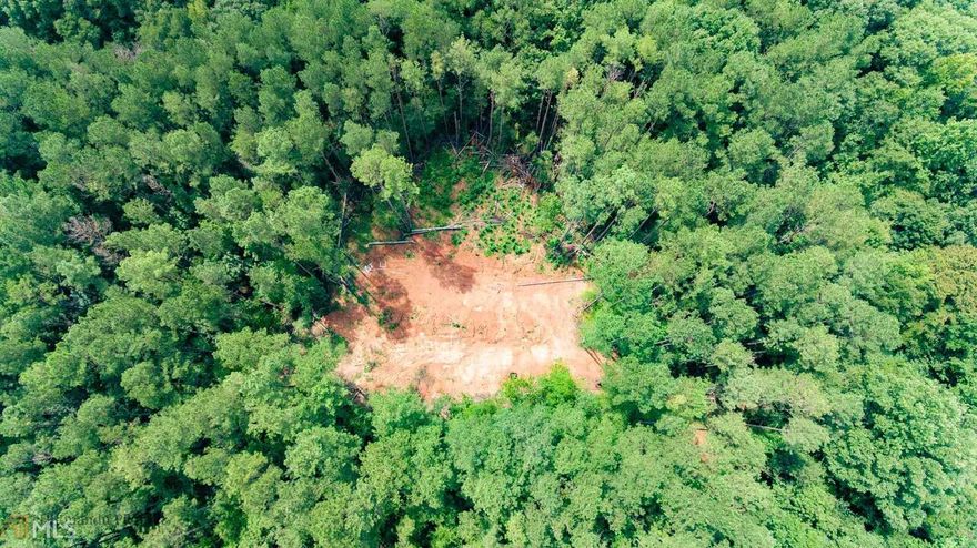 Gorgeous 15+ acre property located in Morgan county! This quiet tract of land is situated on a cul de sac, and the lot boasts hardwoods, ample wide creek frontage, cleared home site, gravel driveway cut in, and so much more! Various types of homes in neighborhood so say goodbye to restrictions and take advantage of this rare opportunity!