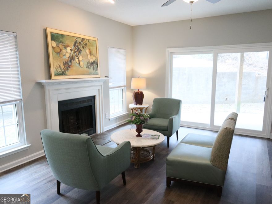 !Beautiful ground-level condo in the heart of Alpharetta-Open to Show!! - Welcome to 3067 Steeplechase Drive, a lovingly maintained 2-bedroom, 2-bathroom home featuring an open-concept floorplan, cozy fireplace, fresh interior paint, and updated bathrooms. Enjoy peaceful wooded views from your private patio and the convenience of off-street parking. All appliances stay, making this home truly move-in ready! - Seller is offering a generous concession at closing and a 1-year home warranty for your peace of mind!
