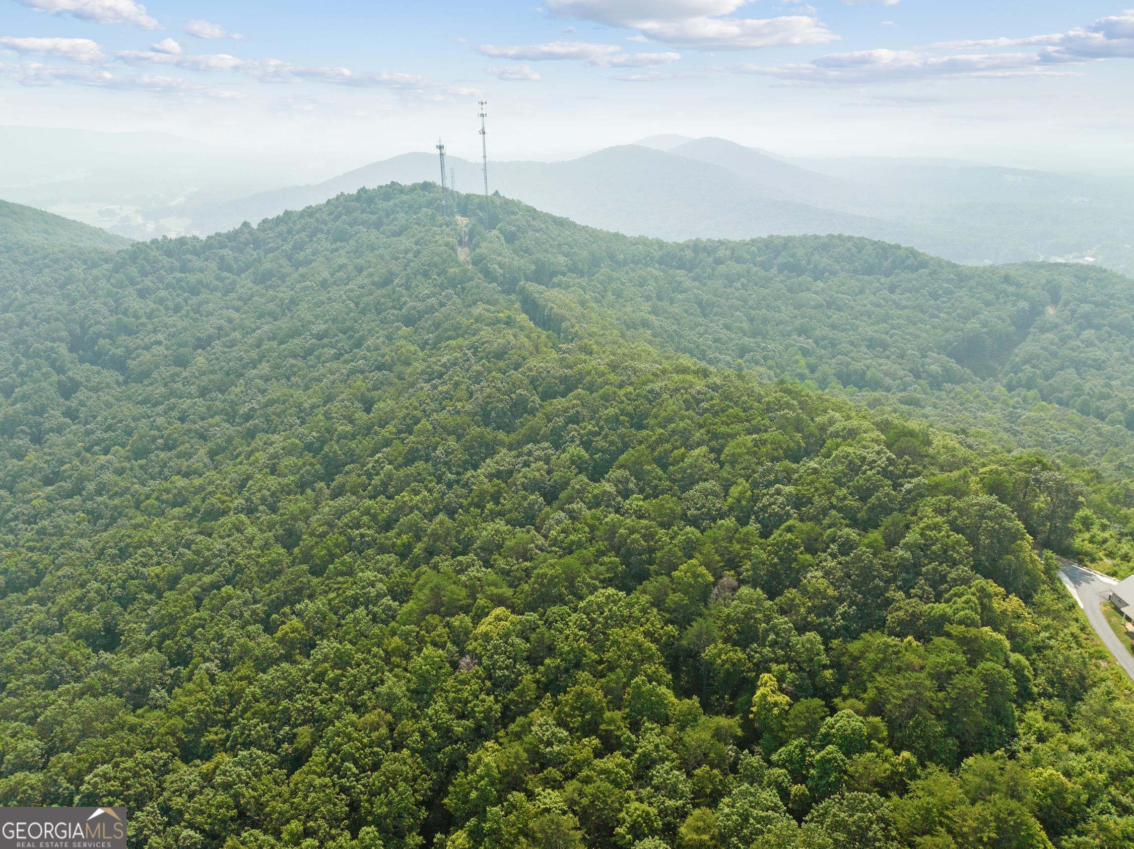 OWNER FINANCING AVAILABLE!! This is your opportunity to Literally, Own a portion of the North GA Mountains!!! This 10.31 acres is a lot with a ton of potential. This boasts Breathtaking Views of the Mountains, land suitable for farming, gardening, hunting...and the list goes on! It is a clean slate just waiting for your dreams to become a reality. It offers multiple building sites and a running creek, many options to give you the view and location you most desire. Lot 4 has been cleared and is ready for your building plans! It is conveniently located in Cleveland but you will feel like you're miles away from it all. It is close to schools, shopping, restaurants, Helen, local wineries, hiking, waterfalls and more! Included in the photos is a plat with multiple suggested building sites.