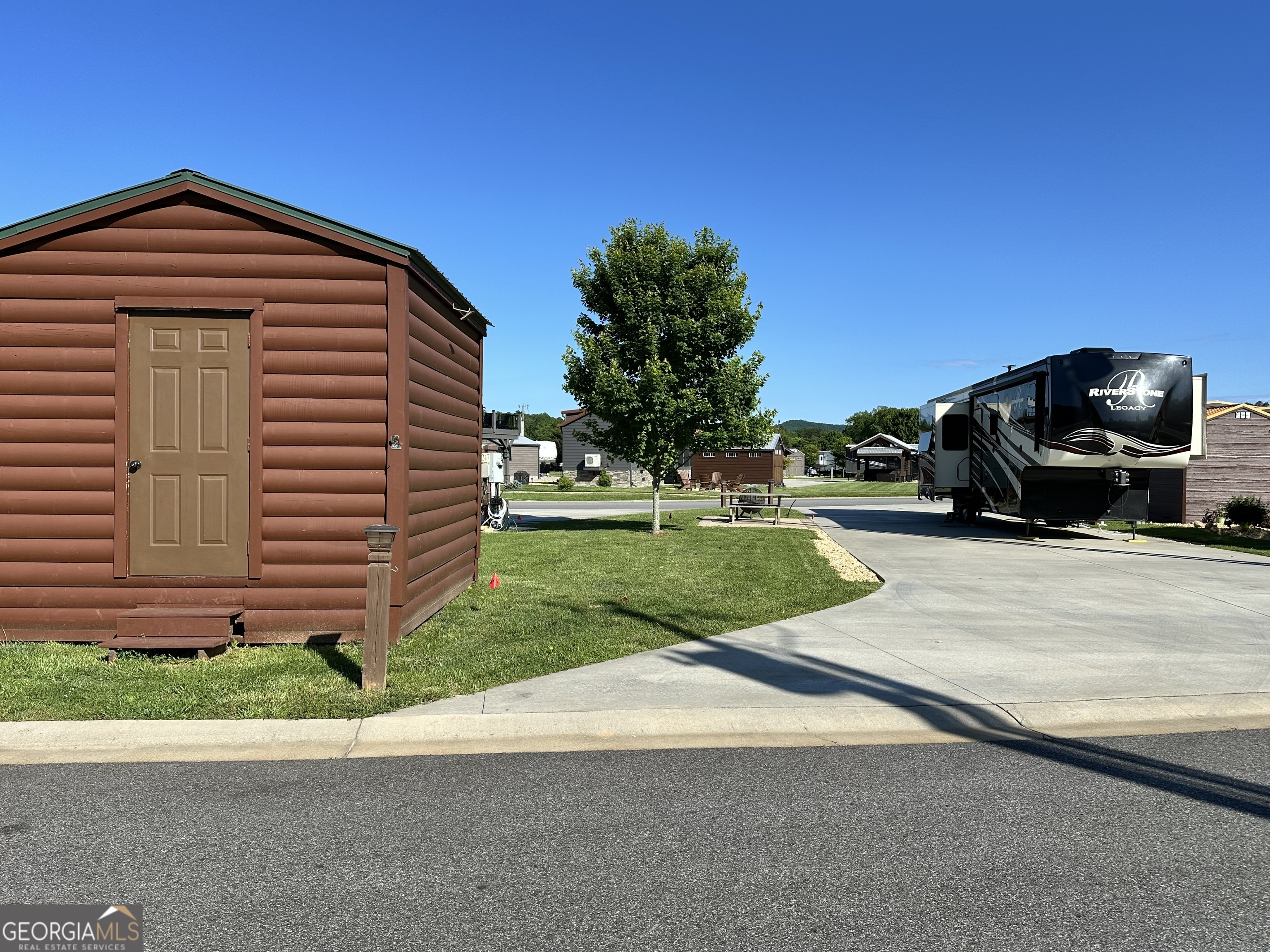 Large 114' pull thru lot at Crossing Creeks RV Resort & Spa. Large grassy area for future pavilion or tiny home addition! Insulated storage shed and added cement pad to accommodate picnic table and firepit. Design the updates on this lot as you wish. Mountain and lake views! Available also as a separate transaction is a Riverstone Legacy 5th Wheel, please contact agent for details. Use as your own mountain paradise getaway or add it to the rental program. Crossing Creeks RV Resort & Spa welcomes class A,B,C rigs as well as travel trailers and fifth wheels