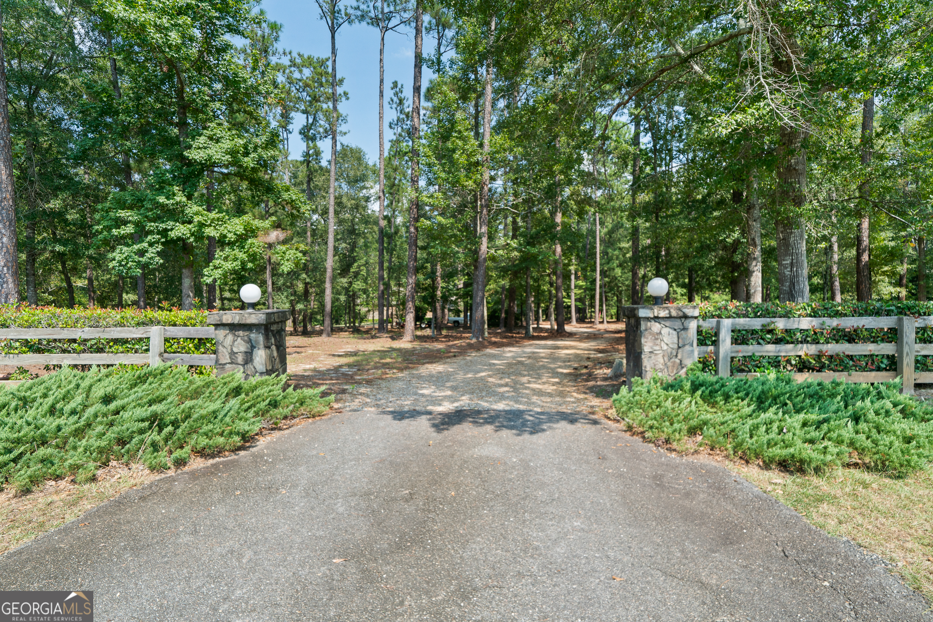 Tucked back off the road on 3.28 acres, this beautiful custom built home has been lovingly cared for by its original owner and offers the perfect blend of privacy, space, and comfort for family living. From the moment you arrive, the tree-lined entrance and circular drive set the tone for the peaceful setting. Step inside and you'll find an inviting layout filled with natural light streaming through large windows, creating a warm and welcoming atmosphere throughout the home. The heart of the home is the spacious kitchen featuring granite countertops, a large island, and plenty of room for gathering and entertaining. The kitchen opens seamlessly to the living and dining areas, while the expansive back deck provides an ideal spot for enjoying morning coffee, family cookouts, or evenings under the stars. With 4 spacious bedrooms, 3 full bathrooms, and an additional half bath, there's plenty of room for everyone. The finished basement adds even more versatility with its own living room, bedroom, and full bathroom -perfect for guests, teens, or a private retreat. This home has been well maintained and offers wonderful bones, ready for you to add your personal touch. From the vaulted ceilings with exposed beams to the wooded backdrop outside every window, it's easy to imagine making memories here for years to come. Outside, the property provides both space and serenity with mature trees, landscaped accents, and a sense of privacy while still being part of a welcoming community. If you're looking for a place with character, space to grow, and the charm of a custom-built home, this is one you don't want to miss.