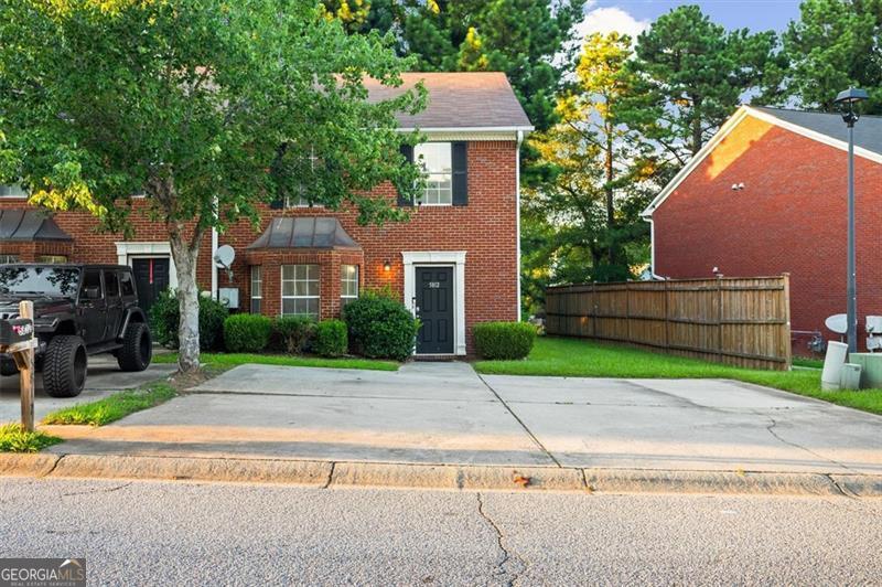 Don't miss this gem! Featuring a newly renovated kitchen this end-unit townhome has a spacious, open floor plan-perfect for entertaining or hosting gatherings in a warm, inviting setting. Upstairs, you'll find a serene primary suite with ensuite bath, along with two additional bedrooms and a full bathroom. Enjoy the low-maintenance back patio, ideal for relaxing without the hassle of yard upkeep. The oversized driveway offers ample parking for the whole family and guests.