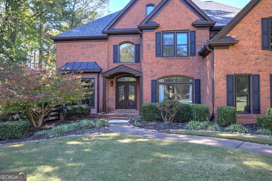 Welcome to an exceptional estate in Milton. Nestled in the prestigious Oak Ridge Green community, this home offers effortless luxury, timeless design and versatile living on a sprawling 1.067 acre lot. Located just 10 min from downtown Milton, and Avalon shopping mall. Great Location. Some key features are the 5 bedrooms and 5 full baths and one half bath, elegant two story foyer with soaring ceilings welcomes you; rich hardwood floors, new double pane windows, updated lighting throughout, and new carpet deluxe padding and fresh interior paint. The basement is half finished, half unfinished - ready to finish out, with a full bathroom. Spacious dining room, and formal living room to the left, offering a versatile space for relaxation or entertaining, which can be customized to suit your needs. To the right, through the French doors, is the first floor bedroom and full bath and additional half bath in the hallway. The gourmet chef's kitchen features granite countertops, oversized island, custom cabinetry, double oven, farmhouse sink, and high end stainless steel appliances. The adjacent secondary living room, exudes warmth with a stunning designer fireplace, and a spectacular view of the lush landscaping. Just off the kitchen is a screened-in outdoor patio with antique wood stove and a space perfect for entertaining. Spacious deck with custom railing. Retreat upstairs to the elegantly appointed primary suite. Double tray ceiling, oversized sitting room with fireplace and built-in bookshelves. The primary retreat is not complete without the spa inspired en suite bathroom, featuring a whirlpool tub, stained glass window, custom shower with glass enclosure, double vanity, and dual walk-in closets. Large laundry room features a washout sink and plenty of shelving. Three additional bedrooms and two full baths, one Jack and Jill with double vanities, finish off the second floor. An additional bedroom and full bath in the basement can be converted to a home theater, guest quarters, game room or fitness studio. Additional workshop with industrial sink and cabinets, heated and cooled unfinished space, and boat door offer endless possibilities. Basement level also features a covered patio and custom travel trailer parking. Additional paved boat door parking pad, 50 amp professionally installed trailer hook up, and pebbled walkway with fire pit area. The beautifully curated and fenced in backyard doesn't end there. This outdoor getaway also features a fenced in flower garden, fruit trees, drive-through gate and additional 50 foot driveway. The level backyard is also a perfect space for a pool! Store all of your toys in the four garage spaces. Other features you won't want to miss are the four irrigation sprinkler system in front yard, and the privacy offered in the backyard. Ideally situated in one of North Fulton's most sought after communities with no HOA, & access to award-winning Milton city schools. This home has everything, and all that's missing is you!