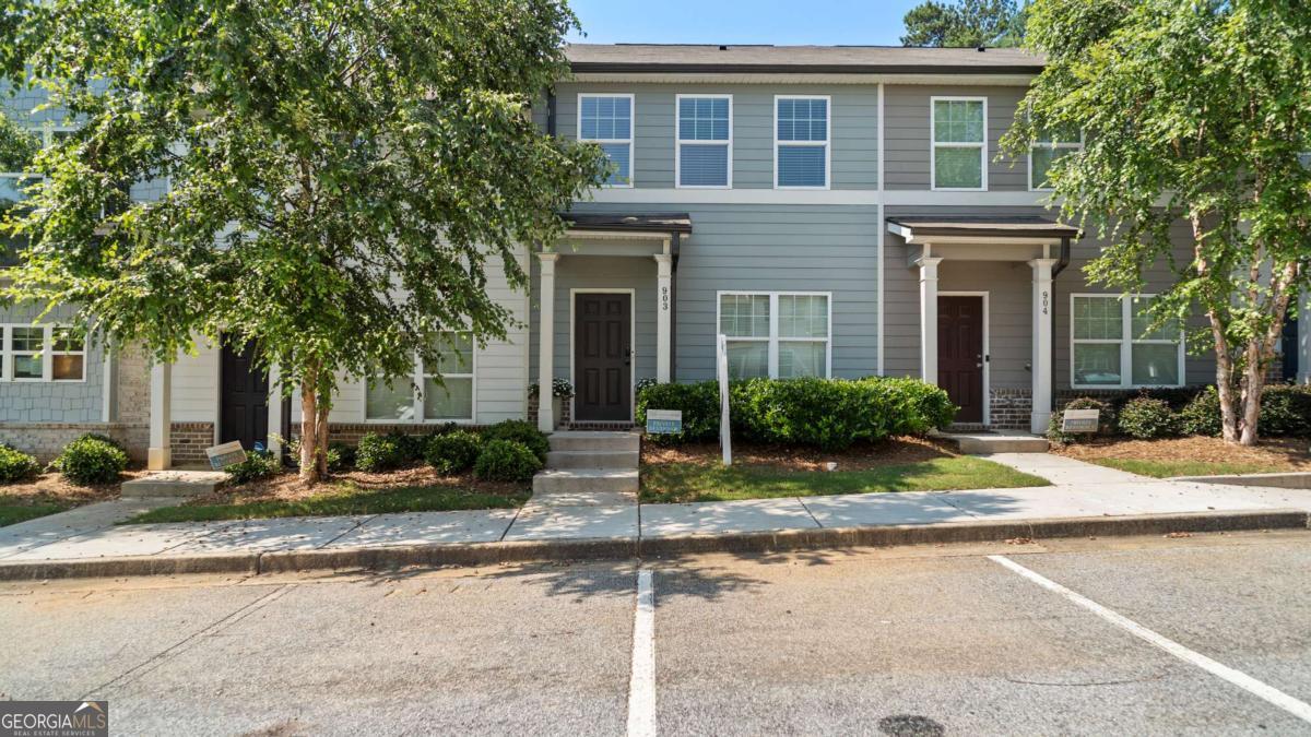 Welcome to your new home in the heart of Lakewood! This beautifully maintained 3-bedroom, 2.5-bathroom townhome offers the perfect blend of comfort, convenience, and style. Located just minutes from the Lakewood Amphitheater, you'll enjoy easy access to local entertainment, dining, downtown Atlanta, and major highways. Directly across the street is KIPP Vision Primary & Academy, and the renowned Ron Clark Academy is just minutes away making this an ideal location for families and education focused professionals. Inside, you'll find an open-concept floor plan with modern finishes throughout. The spacious living area flows seamlessly into a well-appointed kitchen featuring stainless steel appliances, granite countertops, and ample cabinet space perfect for entertaining or everyday living. Upstairs, enjoy a generously sized primary suite with a private bathroom and walk-in closet, along with two additional bedrooms and a full bath. A convenient half-bath downstairs and in-unit laundry with upgraded flooring adding that extra functionality. Don't miss out on this rare opportunity in a growing neighborhood with charm and city access! Great for first time homebuyers and investors! Schedule your tour today.