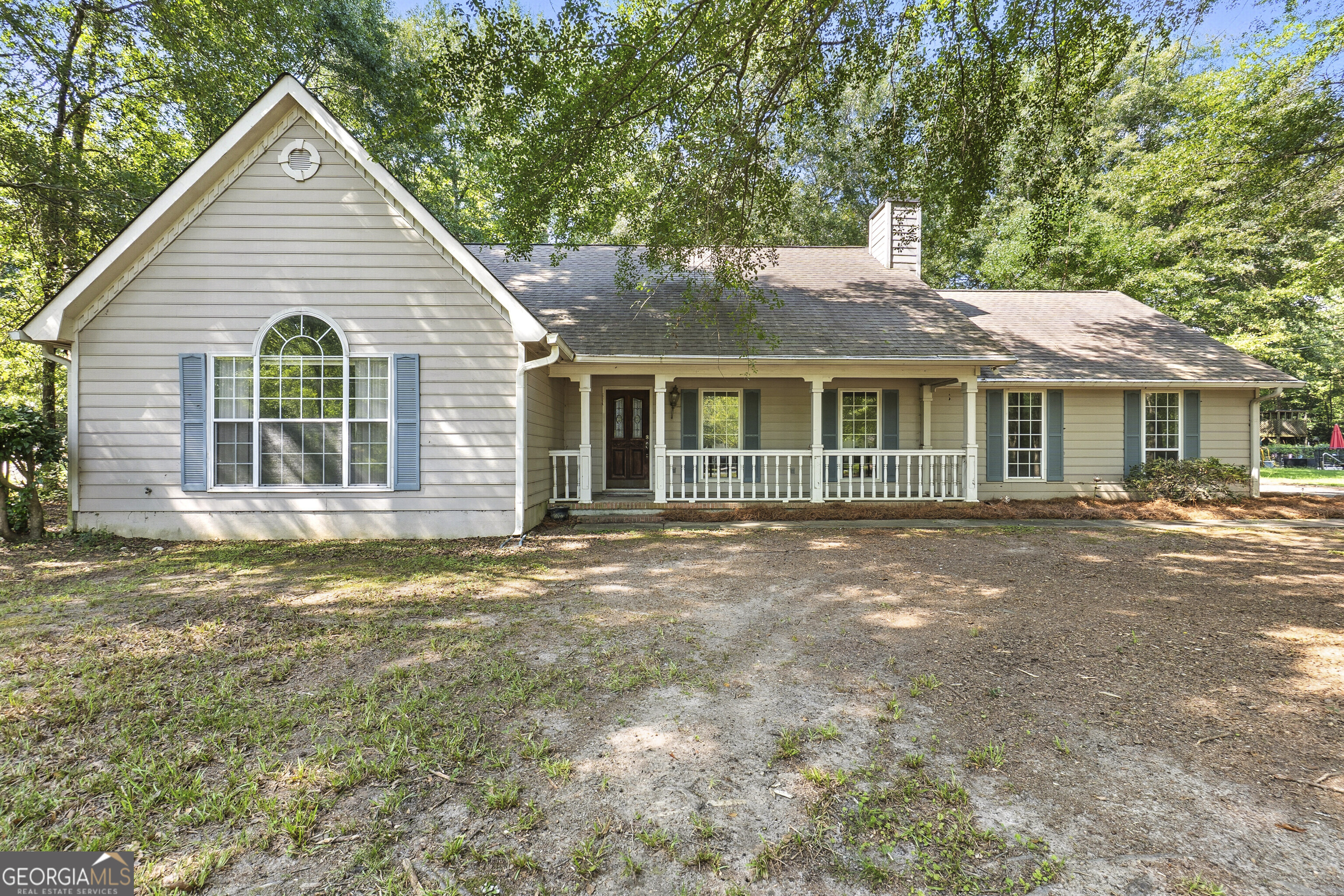 Charming 3 bedroom, 2 bath home featuring a welcoming rocking chair front porch and a spacious living area with a vaulted ceiling and cozy wood-burning fireplace. The open kitchen and dining area offer plenty of space and includeFrench doors leading to the back patio-perfect for entertaining.The owner's suite boasts a walk-in closet, soaking tub, separate shower, and private access to the patio. Enjoy the large shaded backyard with a storage building for added convenience. Ideally located close to shopping, restaurants, and interstate access, yet offering a peaceful country feel.