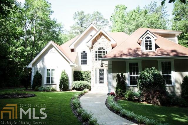 BEAUTIFUL WOODED 4.5 ACRES SITS TWO STORY ON BASEMENT. LOTS OF STORAGE THROUGHOUT THIS HOME. MASTER BEDROOM AND LARGE SECONDARY BEDROOM ON MAIN LEVEL. OPEN TWO STORY GREATROOM, BACK DECK, MANICURED LANDSCAPED YARD, SOLID SURFACE COUNTERTOPS IN KITCHEN. UPDATED KITCHEN CABINETS, NEUTRAL COLORING THROUGHOUT. MASTER SUITE VAULTED AND OPEN FOR RELAXATION. SEPARATE DINING ROOM.POTENTIAL 4TH BEDROOM....PREQUALIFIED BUYERS WELCOMED