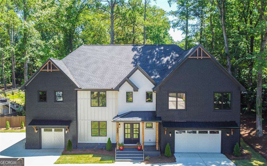 Welcome to Ridgewater Bleu, a remarkable luxury home at 500 Ridgewater Dr, in the prestigious Indian Hills Country Club community of Marietta, GA. This home combines elegance, comfort, and a blend of features designed to enrich your daily life. Perfectly situated in one of East Cobb's most desirable neighborhoods, this property offers unmatched access to country club living while providing the perfect sanctuary for relaxation. ### A Luxurious Living Experience From the moment you walk through the grand double doors, this home invites you to enjoy its thoughtful design and stunning details. The wide plank blonde wood floors lead to a light-filled foyer and a spacious great room with a towering modern stone fireplace. The expansive dining area, adorned with diamond-patterned wall designs and a standout chandelier, is perfect for hosting guests or celebrating family milestones. This home is made for creating memories-whether it's cozy evenings gathered in the great room or hosting friends in a beautiful room filled with oversized windows that overlook lush greenery. Ridgewater Bleu seamlessly combines modern luxury with a comfortable, family-friendly design. ### A Chef's Dream Kitchen The heart of this home is an extraordinary kitchen designed for both the seasoned chef and casual cook. Outfitted with premium Thermador appliances, sleek custom cabinetry, and gleaming stone countertops, it's a space that makes meal prep a true delight. With a large island that seats six comfortably and sophisticated pendant lighting, this kitchen is perfect for everyday meals or entertaining loved ones. ### Unique Features to Love This home offers surprises at every turn. One of the highlights is the upstairs basement-a versatile space perfect for a home gym, workshop, or hobby room. It's a thoughtful addition that brings flexibility to this luxury home. The upper level features peaceful bedroom suites filled with natural light, while shared spaces like a sunny loft and media room provide areas for work, play, and rest. These rooms are designed for everything from quiet early mornings to fun-filled movie nights with family or friends. ### The Ultimate Master Suite The master suite is a true retreat, tucked away to ensure your privacy. The cozy, inviting space leads out to a private terrace, perfect for morning coffee or evening stargazing. The elegant en-suite bathroom, inspired by spa-like designs, offers the ultimate in relaxation with features that elevate your daily routines. The suite even includes its own private laundry area for added convenience, blending luxury and practicality seamlessly. ### Outdoor Living Awaits Step into the backyard, and you'll find the perfect setting for both relaxation and entertainment. Plans for a sparkling pool are underway, promising endless summer days of fun and relaxation. Until then, enjoy the spacious, sprawling patio with a stone fireplace and covered porch that sets the stage for all-season memories-whether it's summer barbecues or warm winter nights with hot cocoa. ### Life in Indian Hills Ridgewater Bleu is part of the vibrant Indian Hills Golf Course community. Enjoy access to golf, tennis, a community pool, and year-round social events. Living here also means being close to some of Marietta's top attractions, like The Battery, Sandy Springs, and Roswell, as well as being zoned for Walton High School. ### Make It Yours Ridgewater Bleu isn't just another home-it's a lifestyle. With luxury finishes, unique features, and an unbeatable location, this residence is ready to welcome you home. Schedule your private tour today and experience a life of comfort and elegance at 500 Ridgewater Drive. This is more than a house-this is Ridgewater Bleu.