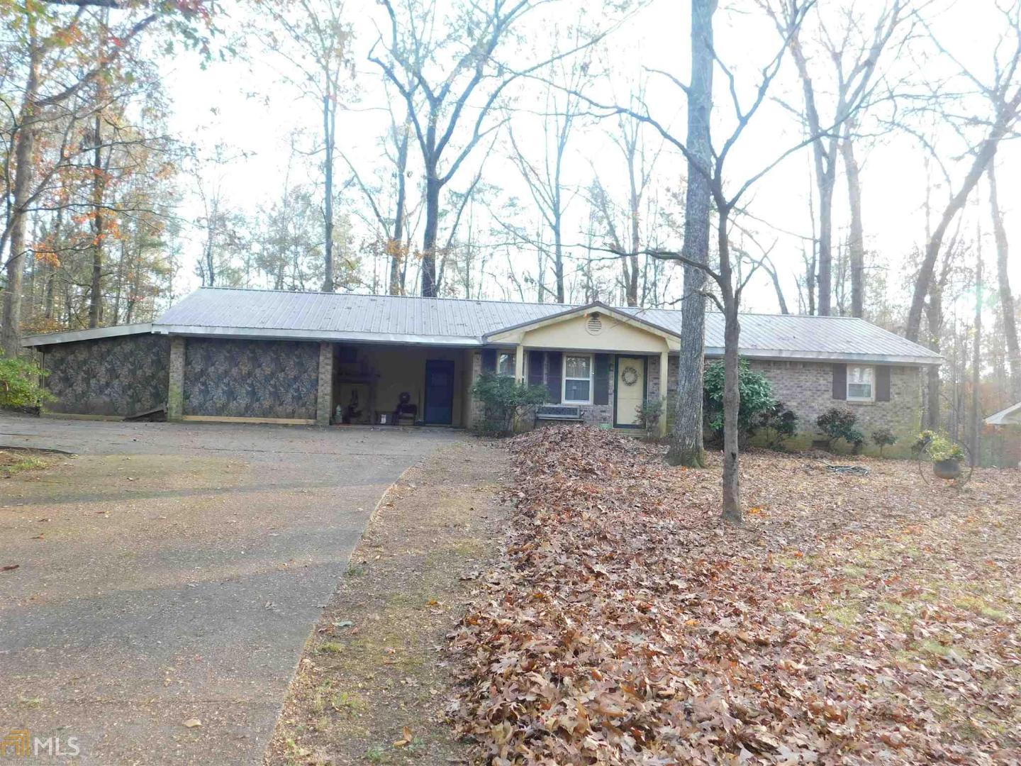 Property sold AS/IS; 4 sided brick ranch; 4 bedroom / 2 bath; Living room; Den with fireplace; laundry room; carport; back deck