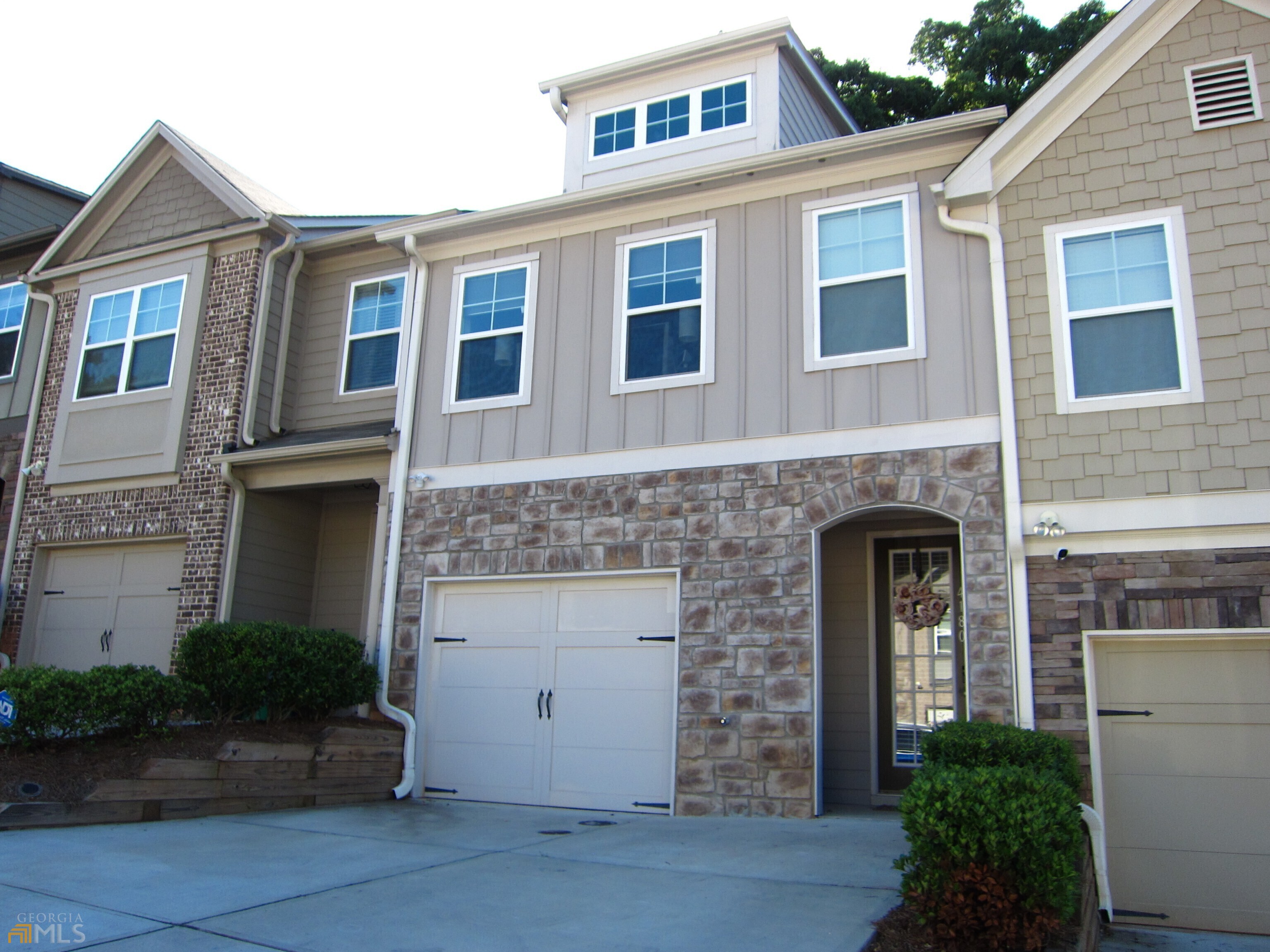 Convenient and ideal location with quick access to I-20, I-285, and a short commute to Downtown Decatur, Emory, and CDC with low HOA fees. Spacious 3 bedroom, 2.5 bath townhouse with private fenced backyard and an inviting covered front entrance. Peek through the entrance foyer for an open concept view all the way through the back door. Fireplace family room is open and airy. All hardwood floors on main level. Kitchen with center island, tall 42" wall cabinets, stainless steel appliances, granite countertops, tile backsplash, and a roomy pantry. Spacious owner's suite has large walk-in closet. The ensuite master bath has double vanities, soaking tub, and shower. Two light filled secondary bedrooms with access to a full bath on the second floor. Laundry room on the second floor conveniently close to all bedrooms. Double driveway parking spaces and a one car garage. Neighborhood guest parking by mailboxes. Google Nest learning thermostats, Doorbell, Eeufy smart Lock on the front door with fingerprint sensor, Fan/light in master controlled by smart switches, plus Ikea smart blinds all stay with the house.