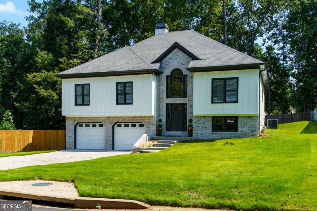 Photo of 209 Tennis Court Lane NW, Kennesaw, GA 30144 (MLS # 10849372)