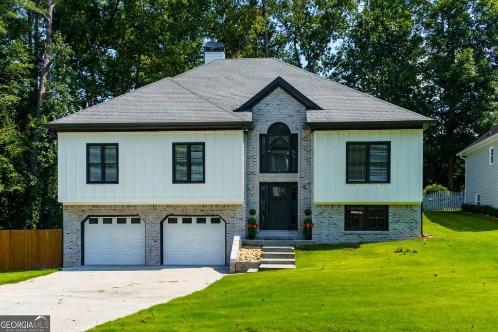 Photo of 209 Tennis Court Lane NW, Kennesaw, GA 30144 (MLS # 10849372)