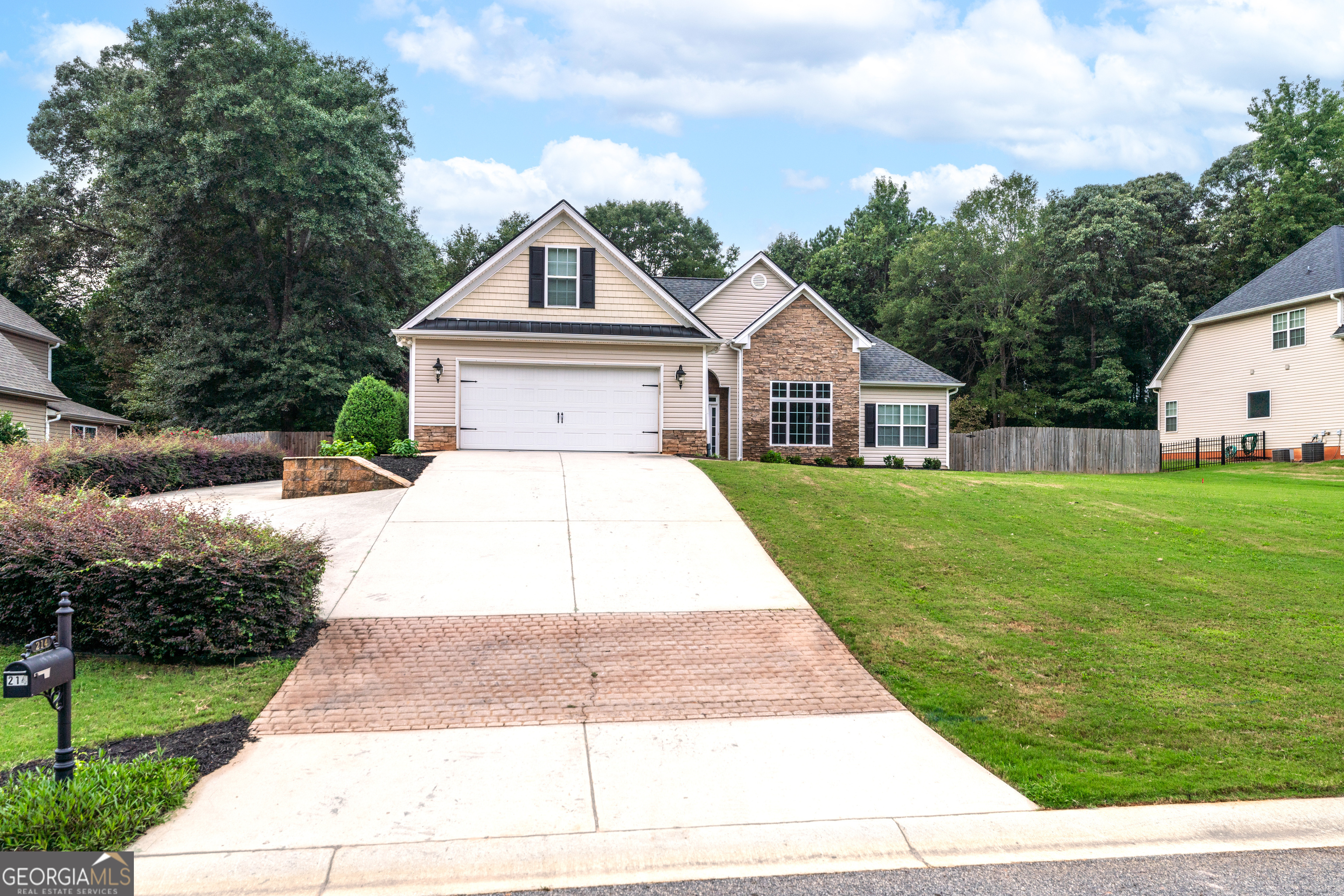 Nestled in Jackson County just off Hwy 129 between Athens and Jefferson, this 3 bed/2 bath home offers the perfect blend of comfort, style, and outdoor living. Step inside to discover a freshly updated interior featuring brand new paint and carpet throughout. The split floorplan provides privacy for the primary suite, which also includes its own screened in private porch and a stunning spa like marble shower & tub surround. Sitting on a spacious half acre lot, this property offers plenty of room to spread out, with possible RV parking on the left side of the home. The amazing backyard is truly a showstopper complete with a wood privacy fence, storage shed, patio, and a custom pavilion featuring electricity, TV hookup, a gas fireplace, and beautiful stained concrete flooring. It's an entertainer's dream, perfect for gatherings year-round. Conveniently located with quick access to Athens and Jefferson, this home combines small town charm with modern updates and fantastic outdoor amenities.