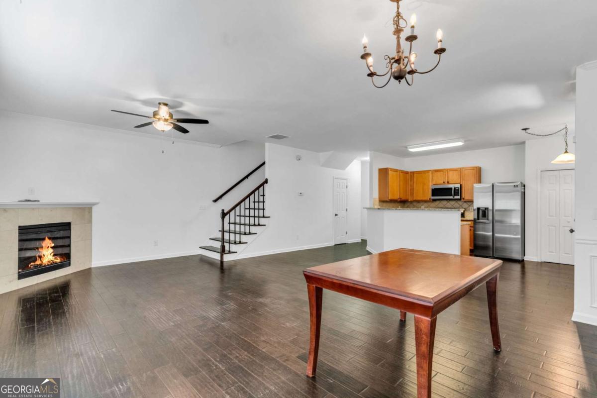 Welcome to this inviting 3-bedroom townhome in Acworth, perfectly positioned across from a public park-ideal for enjoying green space just steps from your door. A private side entry ensures added privacy and a single-family feel, while a backyard with patio offers a peaceful outdoor retreat for morning coffee or evening relaxation. Inside, a bright, open kitchen flows seamlessly into the family room-perfect for entertaining or everyday connection. The entire interior has been freshly painted in a soothing white, offering a neutral and inviting backdrop. On the main level, luxury vinyl plank flooring provides durability and easy upkeep without sacrificing style. One of the standout advantages is its close proximity to Kennesaw State University-just a short drive away. This location makes the home ideal for faculty, staff, students, or anyone wanting easy access to university amenities such as libraries, athletic events, cultural programming, and campus dining. Enjoy potential rental demand, convenience for daily commutes, and easy access to KSU's large and vibrant academic community. Situated within minutes of downtown Acworth, Lake Acworth, and I-75, you'll also enjoy easy access to shopping, dining, entertainment, and major commuter routes.