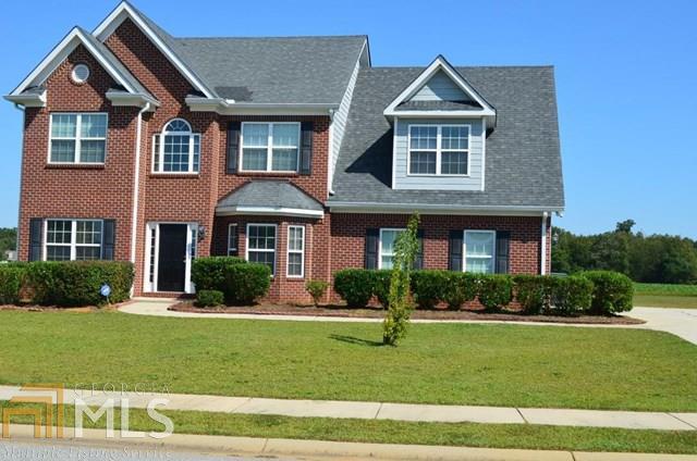 Beautiful brick & vinyl siding home in Macon. Foyer has 12 ft ceiling, hardwood floor that carries into the formal dining room. Carpeted formal living areas and bedrooms. Home has wood burning fireplace, open concept morning area and kitchen with ceramic tile floors. Kitchen is complete with stainless steel appliances. Master suite is stunning w/ a dedicated sitting area. Master bath includes garden tub, separate shower and dual sinks. Fifth bedroom is extra large and can be used as a game/ theater room. The extended driveway to accommodate guest parking. Home comes with 1 year 2-10 warranty.