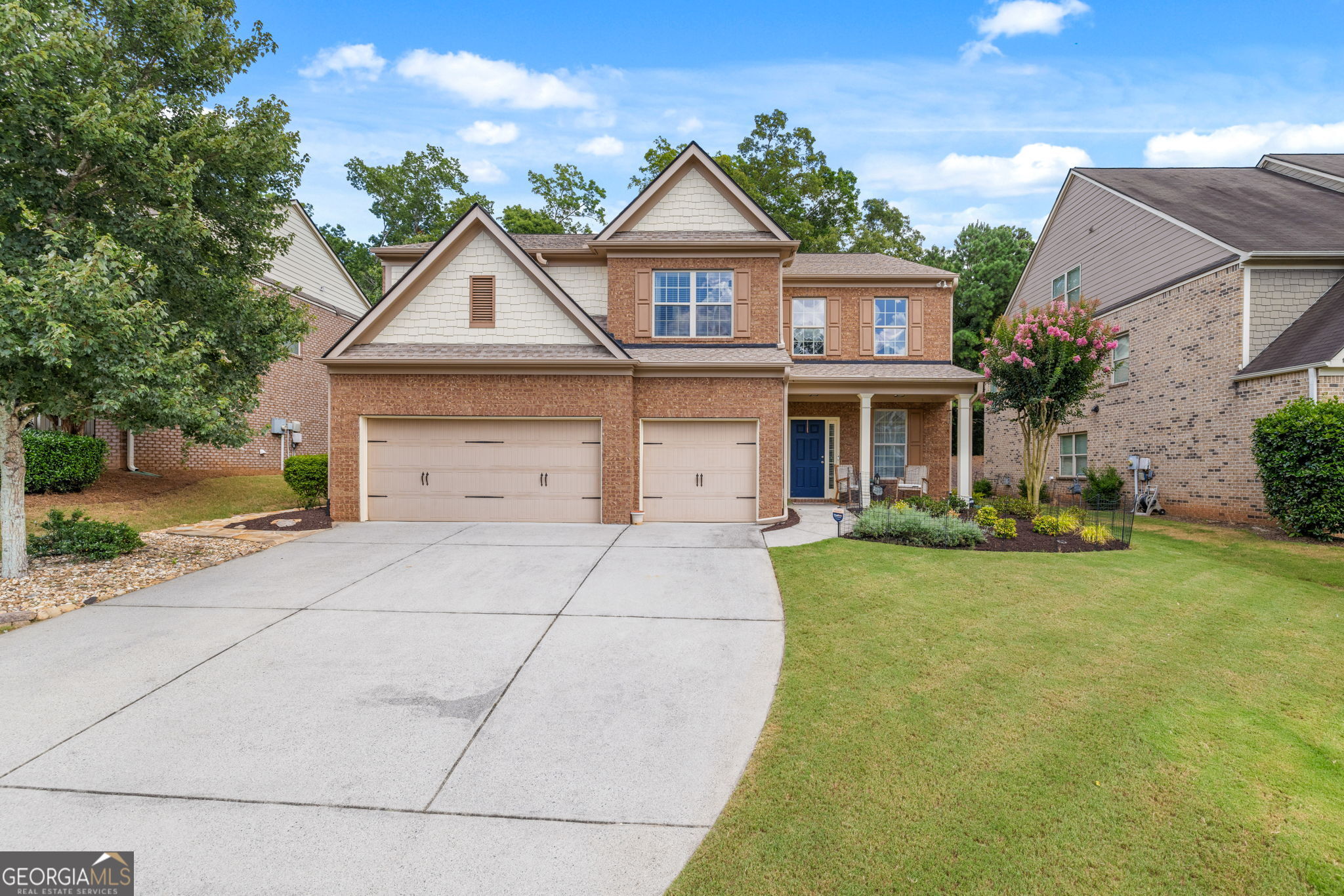 Welcome to this beautifully maintained 5-bedroom, 4-bathroom home located in the highly desirable Champions Run community and zoned for top-rated Lambert High School in Forsyth County. This spacious two-story home offers a bright, open layout perfect for both everyday living and entertaining. The main level features a two-story vaulted living room, a formal living and dining room, a large eat-in kitchen with granite countertops, and a guest bedroom with full bath - ideal for guests or multigenerational living. Upstairs, the oversized primary suite includes a spa-like ensuite bathroom and a custom closet system by Closets by Design. Three additional bedrooms and two full bathrooms upstairs - including a convenient Jack-and-Jill bath - provide plenty of space and privacy. The loft area offers a flexible second living space, perfect for a media room, office, or playroom. Additional upgrades include: Closets by Design systems in the primary suite, main-level bedroom, and mudroom Roof and HVAC less than 3 years old Microwave and stove less than 2 years old Enjoy a private, wooded backyard with an expanded patio, perfect for outdoor entertaining. The large driveway leads to a 3-car garage, offering ample parking and storage. Located in a vibrant swim/tennis community with excellent amenities and minutes from shopping, dining, and parks. Don't miss this exceptional home! Champions Run Forsyth County Schools Lambert High School District