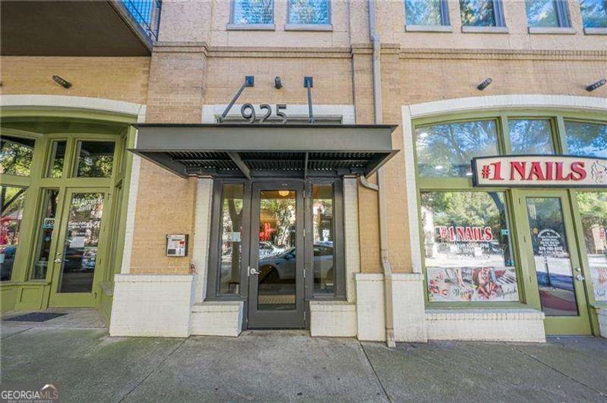 This meticulously maintained corner unit is wrapped in windows, flooding every room with natural light. Start your mornings on the private balcony or grab a latte from Drip Coffee just steps away.    Inside, you'll find an open layout with an expanded living room - a rare feature unique to this unit. The updated kitchen features stainless steel appliances, granite countertops, and hardwood floors throughout. The spacious bathroom offers a walk-in tiled shower, marble double vanity, and custom closet organizers for stylish storage.    Residents also enjoy access to the rooftop deck at 924 Garrett, directly across the street. Two beautiful parks are just blocks away, and the BeltLine runs right along Bill Kennedy Way. With Madison Yards (Publix, AMC, restaurants) only half a mile away and Kroger nearby,  convenience meets comfort in the heart of one of Atlanta's most walkable neighborhoods. Easy access to I-20 and I-75/85 completes the package.