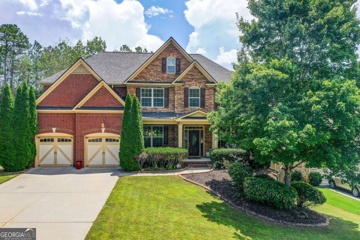 Elegant 6-Bedroom Retreat in Exclusive Brandon Hall Welcome to one of Brandon Hall's finest, a thoughtfully designed and beautifully maintained 6-bedroom, 5-bathroom home nestled in an exclusive enclave of just eight executive residences. Built in 2010 by Sharp Residential (now Toll Brothers), this three-story brick home sits on an expansive lot and offers the perfect blend of privacy, modern upgrades, and community living all within the top-rated South Forsyth school district and just minutes from GA-400 (Exit 13). Main Level Features a welcoming guest suite with full bath ideal for visitors or multi-generational living. Formal dining room with coffered ceiling, perfect for entertaining. Soaring 2-story great room filled with natural light. Cozy fireside family room with built-in gas logs. Chef's kitchen with granite countertops, upgraded cabinetry, gas cooktop, doubles ovens, stainless steel appliances, and walk-in pantry. Upstairs Retreat offers an oversized primary suite featuring custom his-and-hers closets and a private screened sunroom with a jet tub. Spacious secondary bedrooms and baths designed for comfort and flexibility. Fully Finished Terrace Level with custom home theater with integrated surround sound, Open-concept living and dining space and additional rooms ideal for a gym, home office, or guest quarters. Smart Home Ready equipped with app-controlled lighting, security, and surveillance systems, plus a full irrigation system for convenience and peace of mind. Outdoor Living enjoys a professionally landscaped backyard with a large deck perfect for grilling, gatherings, or quiet mornings. Community Perks access to a resort-style pool, two lighted tennis courts, children's playground, and community clubhouse with lake access for water activities. This home is a rare combination of elegant design, smart technology, and lifestyle-enhancing amenities - all in one of Forsyth County's most desirable communities. Come experience Brandon Hall living at its finest.
