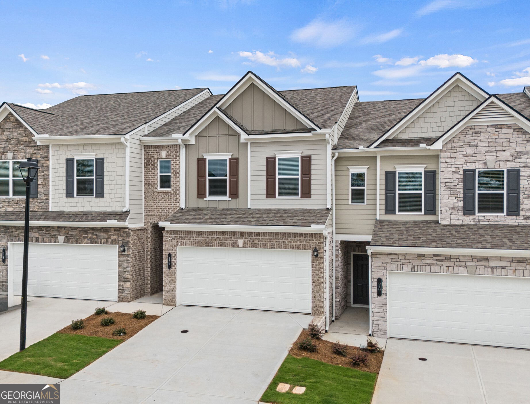 Move-in Ready! The Norwood II floorplan, a thoughtfully designed home by Smith Douglas Homes in the sought-after Franklin Manor community. This stunning residence blends modern design with everyday comfort and offers everything you need for stylish, easy maintenance living. Step inside to discover an open-concept layout that seamlessly connects the kitchen, dining and family room-perfect for entertaining or relaxing with loved ones. The spacious deck extends your entertainment space outdoors. Enjoy upscale touches throughout, including nickel hardware, enhanced lighting package, upgraded cabinetry, granite countertops, vinyl plank flooring on the main level and stainless steel appliances. A sleek linear fireplace adds a cozy focal point in the family room, while the iron rail staircase leads to a versatile loft area. Upstairs, you'll find two secondary bedrooms, a convenient laundry room, and a private primary suite featuring a tray ceiling, walk-in closet and a spa-inspired bathroom with a tiled shower and double vanity. With 9ft ceiling heights on both levels, the home feels airy and light-filled throughout. Lawn maintenance is included in the HOA, giving you more time to enjoy your new lifestyle. Photos representative of plan and not of actual home under construction. Take advantage of seller incentives with use of our preferred lender. Don't miss this opportunity to own a beautifully crafted home in Franklin Manor!!!