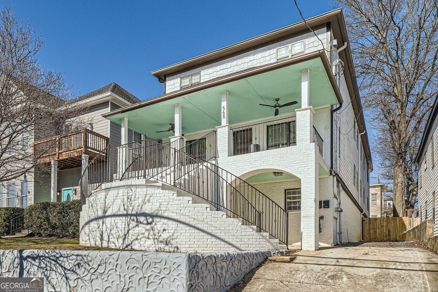 Fully Renovated Beltline Beauty with Exceptional Income Potential! The Current Income is $16,800 per month, based on a month-to-month corporate lease. Welcome to 568 John Wesley Dobbs, a classic yet Fully Updated Home in the heart of Old Fourth Ward, one of Atlanta's most Vibrant and Walkable Neighborhoods. Just Steps from the Atlanta Beltline, Freedom Trail, Krog Street Market, Freedom Barkway Dog Park, and the Shops and Dining of Inman Park and Poncey-Highland, this home places you in the center of it all. The welcoming Covered Front Porch with ceiling fans is perfect for Year-Round Enjoyment just grab a drink and enjoy the view. Inside, the home is filled with Natural Light, boasting an Elegant Living Room with Tray Ceilings, Arched Doorways, and New Hardwood Floors. The Open Concept Floorplan includes a space for Formal Dining, a Fireside Breakfast Nook, and a Dreamy Chef's Kitchen featuring a Marble Waterfall Island, White Cabinets, Marble Countertops and Backsplash, Stainless Steel Appliances, and abundant Storage no detail was overlooked. The Main-Level Primary Suite offers a Spacious Walk-In Closet and a Spa-Like Ensuite with a Soaking Tub, Marble Shower, Dual Vanity, and chic finishes. An additional Bedroom and Full Bath complete the Main Level. Upstairs, you'll find Three Additional Bedrooms, and Three beautifully Updated Full Bathrooms. The Fully Finished Daylight Basement Level is a standout with its Own Private Entrance an ideal setup for Short-Term Rentals, Long-Term Tenants, or a Multigenerational Living Arrangement. This separate Living Space features a stylish Open Concept Living Area, a full Kitchen with Quartz Countertops, White Cabinets, and Stainless Steel Appliances, plus a Convenient Powder Room. The Terrace-Level Primary Suite includes a Walk-In Closet, Spa Bathroom with Soaking Tub, Separate Shower, and Dual Vanity. Two Additional Bedrooms, a shared Full Bath, and a Flex Space (perfect for a Home Gym or Office) make this space incredibly versatile. Step outside to enjoy the Two-Story Rear Deck, perfect for Hosting Guests or Relaxing Outdoors. The Massive Flat, Fully Fenced Backyard is a rare find in Intown Atlanta. A Long Driveway offers ample Parking for you and your guests. Whether you're an Investor looking for Serious Rental Income, a homeowner seeking Flexible Living Options, or someone who simply wants to be in the Middle of it All, this home delivers. With Easy Access to Parks, Restaurants, Shops, and Entertainment, this home is the Perfect Blend of Style, Functionality, and Location. Don't miss your chance to live and earn in one of Atlanta's Most Desirable Neighborhoods!