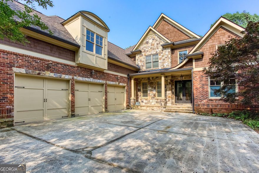 Introducing an extraordinary opportunity to own a meticulously crafted European-style estate just minutes from the highly acclaimed Pope High School. Perfectly positioned in one of East Cobb's most coveted neighborhoods, this impressive all-brick residence blends timeless sophistication with modern luxury-offering an unparalleled lifestyle for the discerning buyer. From the moment you arrive, the stately curb appeal commands attention, with manicured landscaping enveloping the grand 4-sided brick facade and expansive 3-car garage. Step through the double doors into a soaring two-story foyer, where a sweeping staircase sets the tone for the refined interiors beyond. This expansive six-bedroom, five-and-a-half-bath home is thoughtfully designed for both everyday living and entertaining. The light-filled great room boasts elegant coffered ceilings and opens directly to a sweeping deck that overlooks a beautifully landscaped, private backyard-ideal for indoor/outdoor living. For those who work from home, the main-level office/library offers quiet sophistication, while the formal dining room and inviting fireside family room provide the perfect settings for hosting or relaxing. The heart of the home is a gourmet chef's kitchen, equipped with top-of-the-line Wolf and SubZero appliances, custom cabinetry with accent lighting, double ovens, a farmhouse sink, and abundant counter space-perfect for entertaining with ease. The main-level primary suite is a true retreat, featuring a luxurious fireside bedroom experience, spa-inspired bath with soaking tub, oversized walk-in shower with sauna capabilities, and custom closets. Downstairs, the fully finished terrace level offers the ultimate in flexibility and comfort-complete with a home theater, private gym, and walkout patio. Designed with the future in mind, this home is also prepped for an elevator installation to seamlessly access all levels. Enjoy the best of East Cobb living-moments from top-tier schools, fine dining, boutique shopping, and community parks. Impeccably maintained and move-in ready, this exceptional property is the definition of luxury living.  Schedule your private tour today and discover everything this extraordinary residence has to offer.