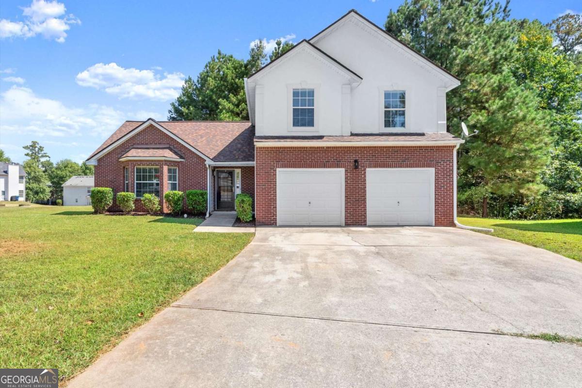 Welcome to this charming home in Fairburn! This home features 3 spacious bedrooms and 2 full bathrooms open floor plan with 2 living rooms. Recent updates include fresh interior paint, new flooring throughout, modern bathroom upgrades, and updated fixtures for a clean, move-in ready feel. Sitting on nearly half an acre, the home offers a generous yard perfect for relaxing or entertaining. With a fireplace, central heating and cooling, and a two-car garage, this home blends comfort, style, and value in a quiet, friendly neighborhood.