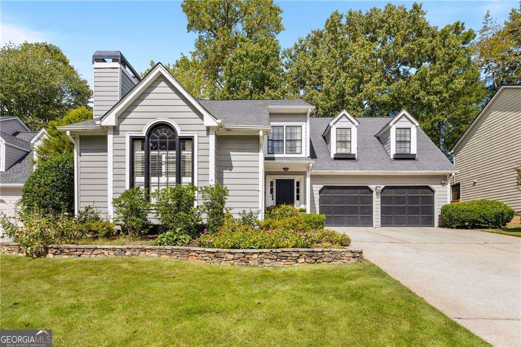 Tucked away on a quiet dead-end street in the heart of Brookhaven, this open-concept home with a two-car garage blends thoughtful design with everyday comfort. Vaulted ceilings and a cozy fireplace create a warm and airy feel in the family room, while the kitchen features white cabinetry, a sleek glass tile backsplash, and open sightlines to the dining area-perfect for easy entertaining. Hardwood floors flow throughout the main level, which also includes a powder room and a convenient laundry room. Upstairs, a custom built-in landing adds charm and function. The spacious owner's suite offers a peaceful retreat with a sitting area, custom closets, and a spa-inspired bath featuring double floating vanities, a glass-enclosed shower, and a separate soaking tub. Two additional bedrooms-each with ceiling fans-provide ample space for guests or family. Enjoy outdoor living year-round from the screened-in porch overlooking a private, fenced backyard. With top-rated schools and Brookhaven's best shopping, dining, and parks just minutes away, this home offers location and lifestyle in one inviting package. Lynwood Park is one of Brookhaven's most beloved neighborhoods, known for its active community, splash pad, basketball courts, playground, and close proximity to local favorites like Avellino's and Osborne Dog Park.