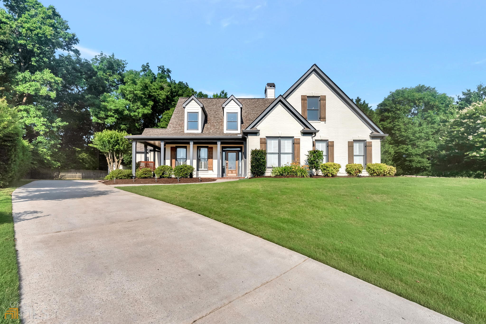 Modern craftsman style house with four sided painted brick. A two car garage and beautiful private backyard. Inside the home you have updated laminate floors throughout the whole house. A separate dining room with wainscotting trim. Updated large eat-in kitchen with white cabinets and marble countertops with gas appliances and double oven. Walk in pantry and walk in laundry right off kitchen. 15 foot ceilings in living room with fireplace and built-ins. Large master bedroom has vaulted ceilings, a walk in custom closet and extra built-in on the wall. Updated master bath with separate jacuzzi tub and large shower, linen closet and water closet with a dual vanity sink. Two large guest rooms on main floor with a bath in hallway. Large teen/in-law suite upstairs with full bath and walk in closet.