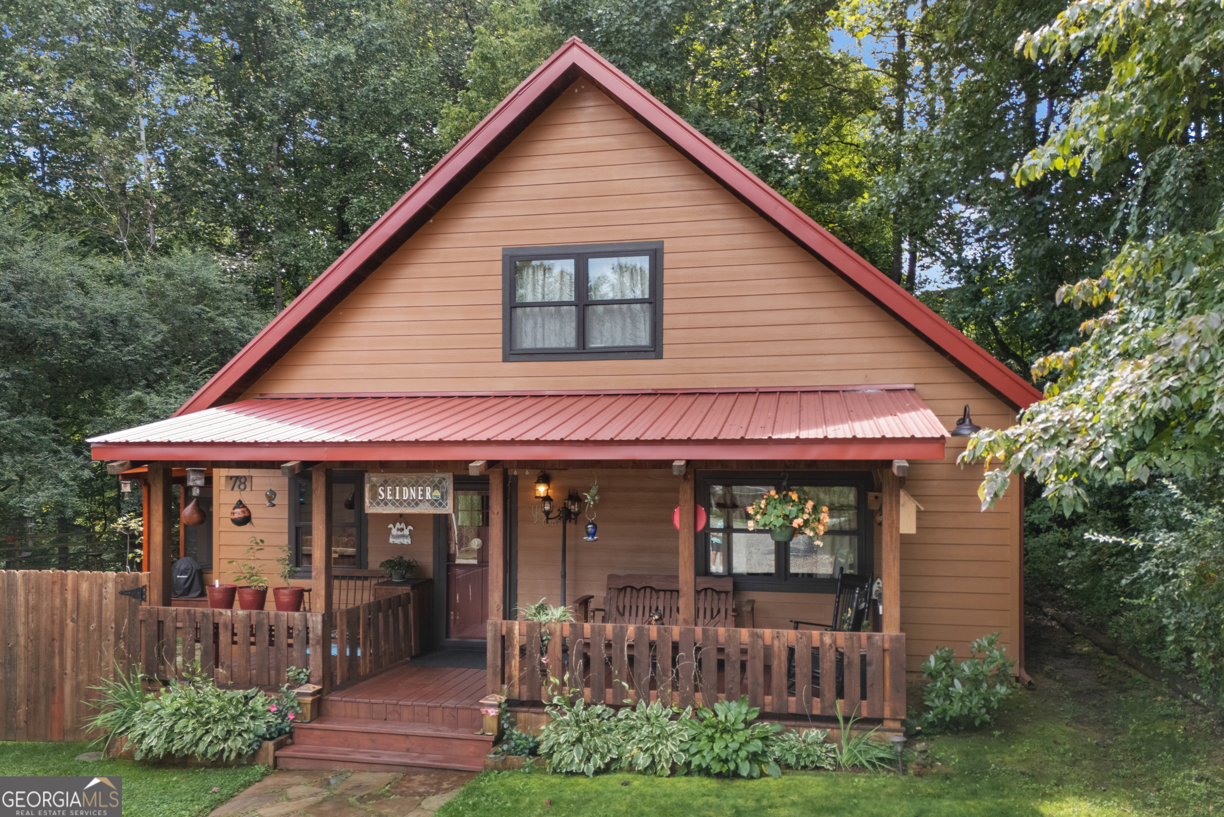Country rustic, LOW MAINTENANCE home CONVENIENTLY located in town with PRIVACY. High-end finishes throughout home, including QUARTZ countertops, STAINLESS appliances. HARDY BOARD exterior, METAL ROOF, LEVEL FENCED yard, screened in PORCH. Delightful attention to detail throughout the home, walk-in closet in master suite on main level, slate showers, copper sink custom vanities, generous insulation makes for very comfortable temperatures inside. Loft, woodburning stove, Anderson windows, hot tub, High ceiling garage for RV. Additional mother-in-law suite in garage, would make for a great Airbnb! CALL ME TODAY!