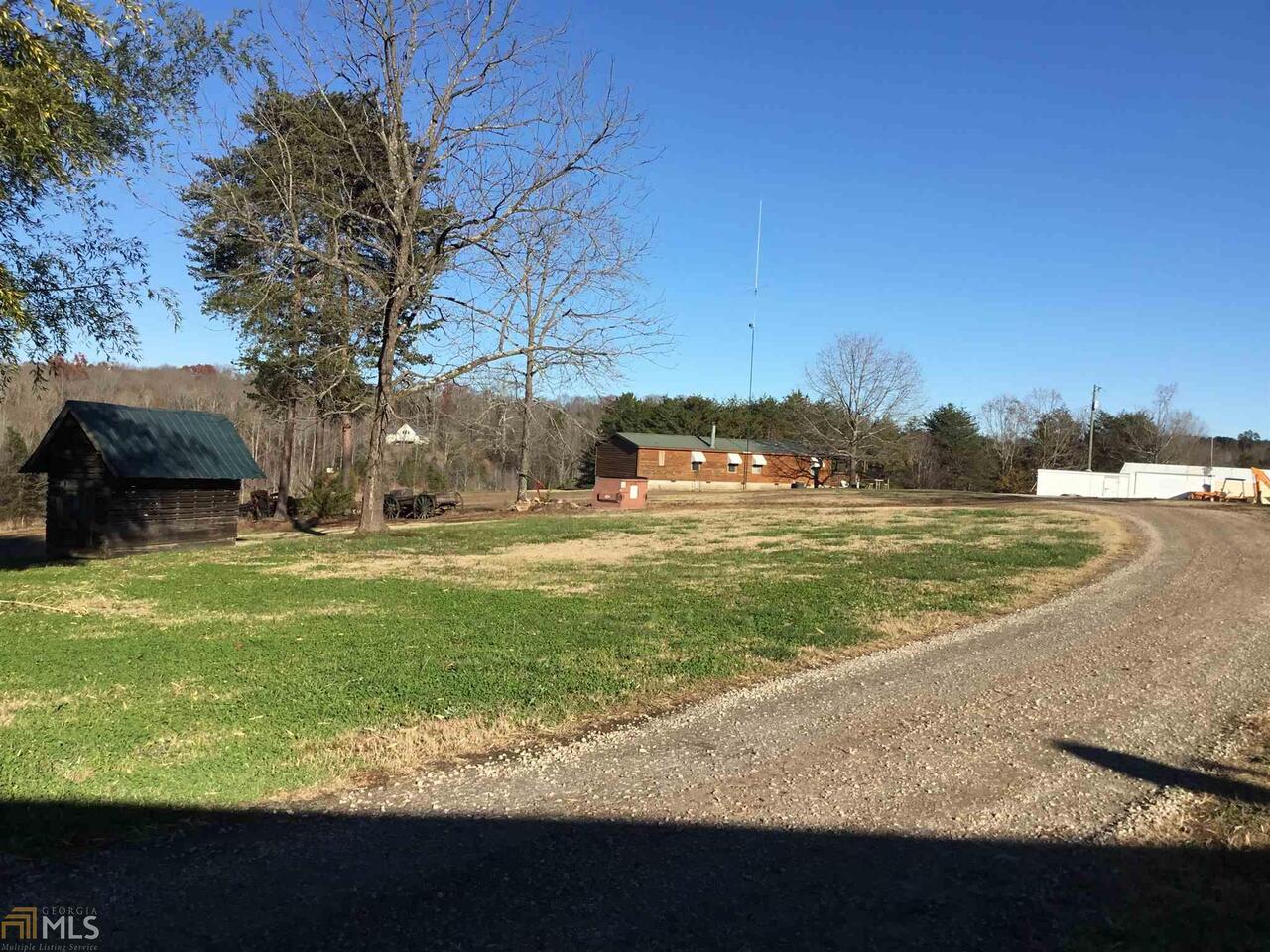 10 beautiful acres with pond, 3/2 mobile home, 1/1 mobile home and beautiful cabin. County water going in at road. Would make a great place for the family with plenty of seclusion. Pond on the backside for great fishing too.