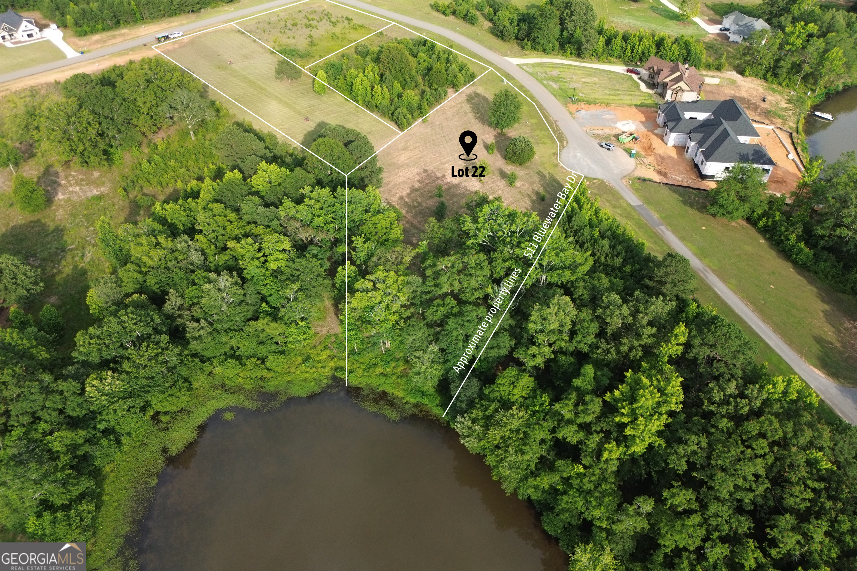 Located within the serene community of Peninsula at Eagles Pointe, this expansive 1.23 acre waterfront lot offers a great home site with double water views. This lot is situated amidst lush greenery and tranquil surroundings located in the cul-de-sac of the park, pavilion, lakeside firepits, and mailboxes. Peninsula at Eagles Pointe is a beautiful, gated community on Lake Tobesofkee with amazing amenities. Enjoy the community features of a private boat ramp, neighborhood playground, and lake/sunset viewing deck. Accessible utilities including water and electricity readily available, facilitating convenient development. Schedule a viewing today.