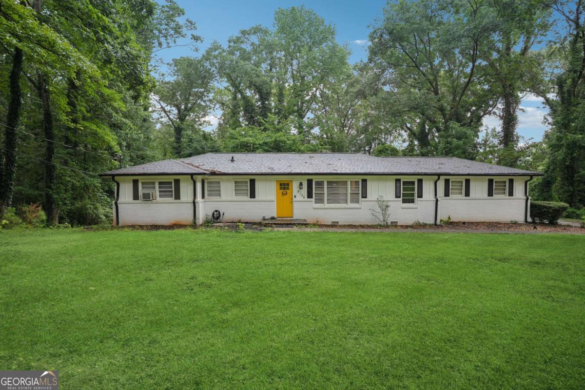 Step into this renovated 4-bedroom, 2-bath home, nestled on nearly two private acres in a quiet Ellenwood neighborhood. The striking all-white exterior offers stunning curb appeal, while the bright, semi-open interior welcomes you with stylish modern finishes and abundant natural light. The heart of the home-a fully updated kitchen-features brand-new stainless steel appliances, sleek cabinetry, and generous storage space. A fully finished basement provides even more room to relax, work, or entertain. Each bedroom offers flexibility and comfort, making it easy to tailor the space to your lifestyle. Outside, enjoy a peaceful, tree-lined backyard perfect for unwinding or hosting gatherings. With new appliances throughout and thoughtful updates in every corner, this refreshed Ellenwood gem is move-in ready. Located just minutes from I-285, this home offers easy access to the airport, downtown Atlanta, Decatur, and other key destinations-making your daily commute or weekend outings a breeze. Schedule your private tour today and discover the perfect blend of space, style, and convenience.