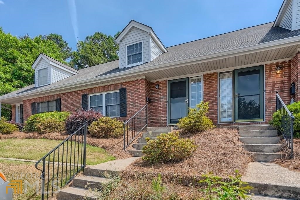 Fabulous 4-sided brick townhome, freshly painted, new carpet, new lighting canisters and fixtures. Large family room, loaded with canister lights. Kitchen, with white cabinets, appliances. Huge Master, 2 closets and sitting/office area. Master bathroom, with whirlpool tub, separate shower. Spacious secondary bathroom. Beautiful large private patio, brick fence. Swimming pool community. HOA includes yard maintenance, water and trash. Great location! Minutes from I-285 and walking distance to Kroger. Great location, minutes from restaurants, banks, Farmers market, and all kind of stores you name it. Smart network alert system 2-in-1 with combination smoke & CO wireless alarms were installed in 2022.