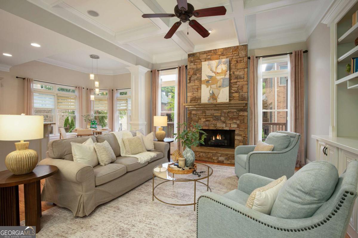 Welcome to Parkside Manor, a sought-after community with award winning schools, short walking distance to famous Webb Bridge Middle School, and directly adjacent to beloved Webb Bridge Park, featuring miles of scenic trails, dog parks, children's playgrounds, tennis and pickleball courts, and sports fields. With two dedicated private entrances to the park, this neighborhood also offers a large community pavilion and a private sparkling pool for residents to enjoy. Also located just a short drive from Avalon, Halcyon, and Downtown Alpharetta, this home offers convenient access to some of the area's best dining, shopping, and entertainment. And with the Webb Bridge Road improvement project underway, the area will soon feature expansive sidewalks, making it even easier to enjoy the nearby Big Creek Greenway's miles of picturesque trails. This beautifully maintained home perfectly balances comfort and functionality. At its heart is the chef's kitchen, equipped with a Wolf 4-burner range with griddle, exterior venting, warming drawer, and a convenient butler's pantry-ideal for both daily living and effortless entertaining. Just outside, a charming deck with trellis creates the perfect setting for al fresco dining. Inside, the spacious formal dining room features a cozy fireplace, while the family room showcases a striking stacked-stone fireplace, providing warm and inviting spaces for gathering and relaxation. The main level also includes a guest suite with a private en suite bath, offering comfort and privacy for visitors. Upstairs, the oversized primary suite serves as a serene retreat, complete with a private sitting area and its own fireplace. The finished terrace level expands your living space with a private office and a flexible area ideal for movie nights, game days, or entertaining guests. Step outside to the fieldstone patio and enjoy the peaceful ambiance of the backyard. Thoughtful updates include new carpet (2023), refinished hardwood floors (2023), fresh interior paint (2023), water heater (2023), and roof (2020). Don't miss your opportunity to live in this remarkable home and location!