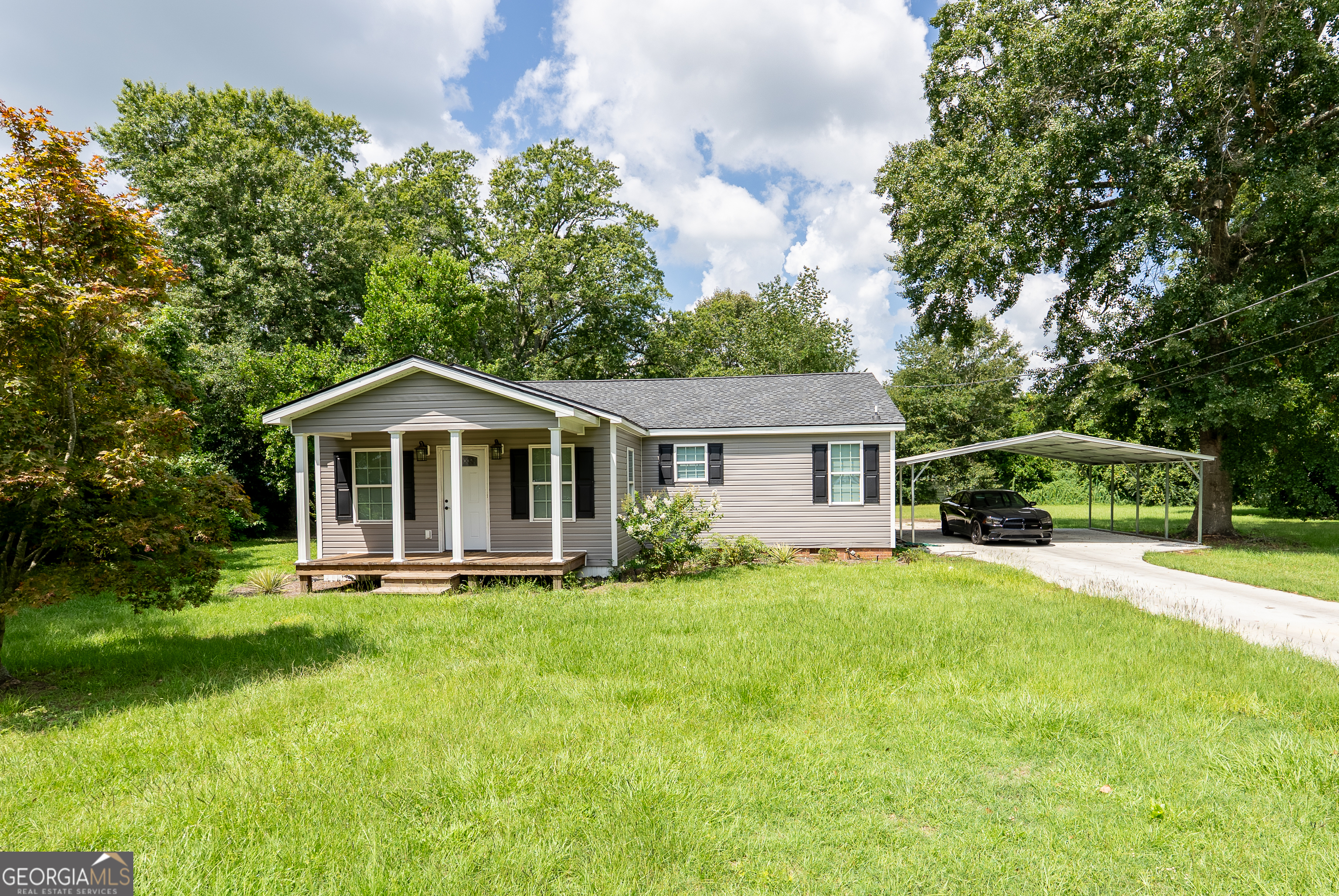 Charming 3-Bed, 2-Bath Ranch in Pelham, GA Welcome home to this beautifully updated 3 bedroom, 2 bathroom ranch-style home on nearly a half-acre lot in Pelham! Step inside to find a bright and inviting layout featuring all hard-surface flooring-perfect for easy maintenance and modern living. The kitchen has been tastefully updated with contemporary finishes, offering plenty of cabinet space and functionality for both everyday meals and entertaining. Both bathrooms have also been renovated with fresh, stylish details, providing a move-in-ready feel. Enjoy outdoor living on the spacious back deck, overlooking the large yard with endless possibilities for gardening, play, or relaxation. With its combination of updates, space, and charm, this home is the perfect blend of comfort and convenience. Don't miss the chance to make this Pelham gem your own-schedule your showing today!