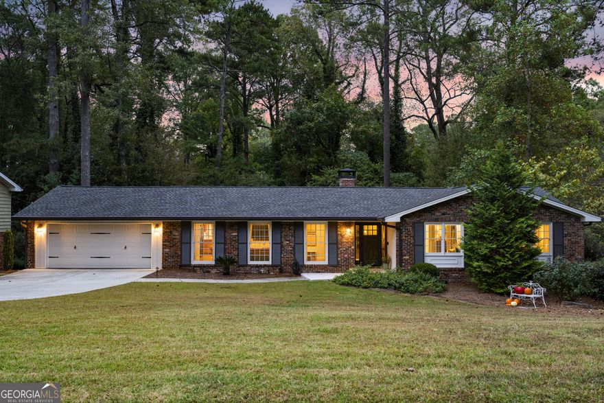 This home may appear to be a classic ranch-but step inside, and you will discover a delightful surprise. The inviting floor plan strikes the perfect balance between openness and coziness, creating an easy flow for both everyday living and entertaining. The chef's kitchen features custom wood cabinetry, new quartz countertops, a stylish backsplash, and updated hardware-all with a view to the comfortable family room. A charming fireplace anchors the space, offering warmth and ambiance during cool fall and spring evenings. A screened porch off the kitchen and dining area provides a serene view of the surrounding woods making this an ideal spot to enjoy morning coffee or host friends for a relaxed evening. Renovated bathrooms bring a touch of modern luxury, while rich hardwood floors create a warm, cohesive feel throughout this home. Expansive terrace level, filled with natural light, flows through double French doors to another deck and extends your living options with a flexible layout. The convenient kitchenette and full bathroom create a superb space for a private suite when guests, friends or extended family visit. Nestled among mature trees, this home feels like a private retreat yet minutes from premier dining, boutique shopping, and major highways. In an exceptionally friendly and established community, you will enjoy both tranquility and convenience-a rare combination that defines modern luxury living.