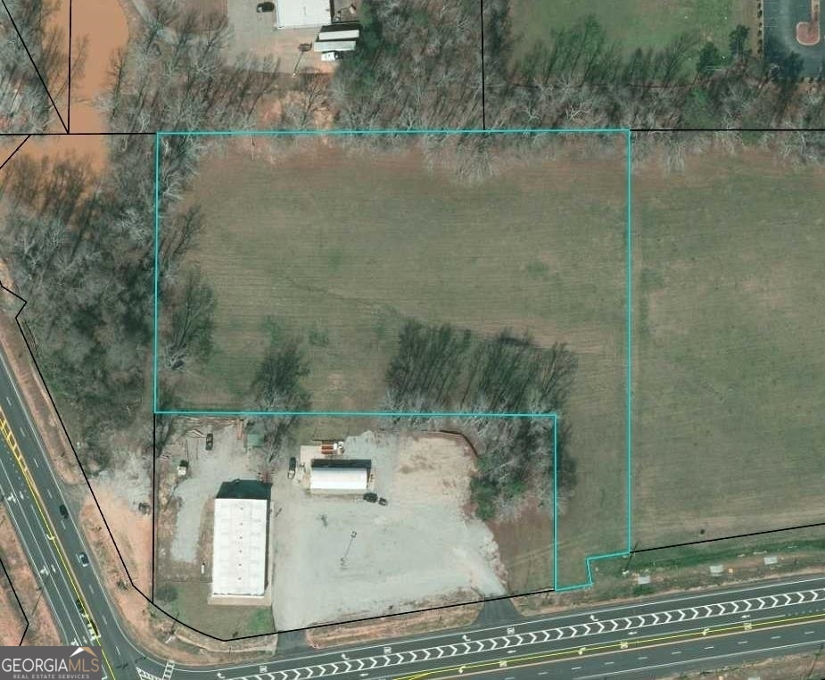 Prime 4.38 Acre Commercial Lot, .3 miles from The Orchard Hills Business Park and 2 Miles from the Newnan/Coweta Airport. All utilities are on site. Call agent for details.