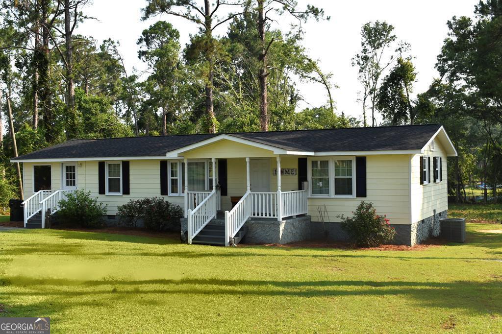 Nestled in the heart of Swainsboro, this charming residence boasts meticulous care and maintenance. With four spacious bedrooms and 1 full bathroom and a half bath ensuite, this 1608 square foot home provides ample living space. Notable features include a new roof (installed this year), newer windows, and a new HVAC system (installed this year). A formal dining room accommodates larger gatherings, while the newly renovated hall bathroom adds a touch of modernity. Residents can enjoy the nearby Harmon Park, featuring tennis courts, walking trails, and picnic areas, all within walking distance. The park's amenities include four ponds, playground equipment, and restroom facilities, making it an ideal spot for family gatherings and outdoor activities. Short drive to all the schools and College. An additional 1.58 acres is available to be purchased next door. Call Melvin "Charles" Tapley for more details (912) 245-0230