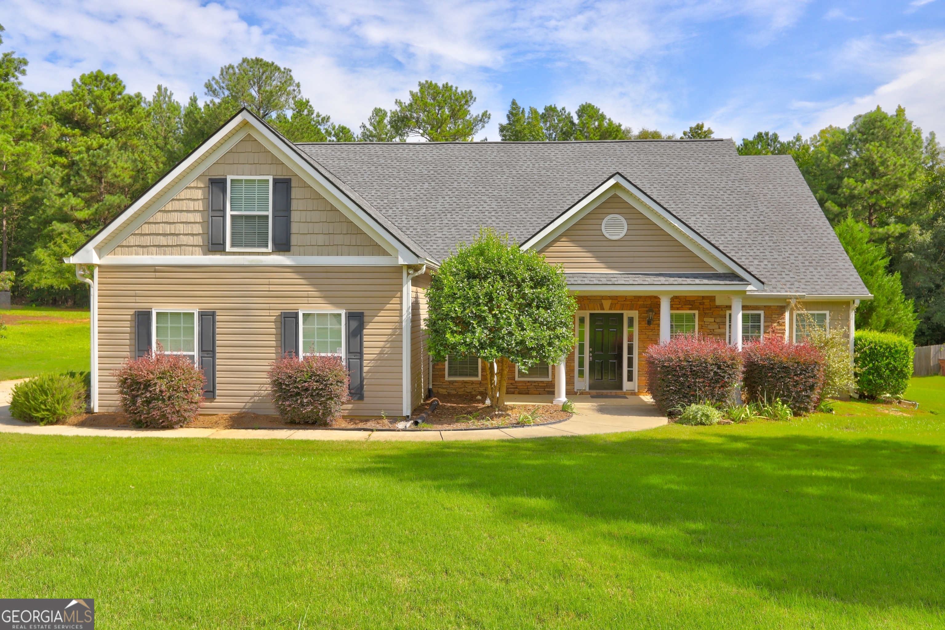 Welcome to this beautiful 3-bedroom, 3-bathroom home, conveniently located just 5 miles from Indian Springs State Park and High Falls State Park. Enjoy the privacy of the bonus room above the garage, complete with its own A/C unit and full bath. This residence offers an inviting living room, family room, dining room, and an eat-in kitchen. The home features brand new Whirlpool appliances, including a refrigerator that stays. Freshly painted and new luxury vinyl plank flooring, it combines modern comfort with style. The large master bedroom is complemented by a large master bath, while the secondary bedrooms share a well-designed Jack and Jill bathroom. Recent updates include a new roof and an HVAC system less than 2 years old. The covered back porch and spacious backyard, complete with fruit trees and a shed, offer plenty of outdoor enjoyment. Nicely landscaped and an underground sprinkler system. With its prime location and move-in ready condition, this home is ready for you to enjoy! **Lender credit if buyer uses preferred Lender - Atlantic Home Mortgage - Steven Mueller - 678-654-2981