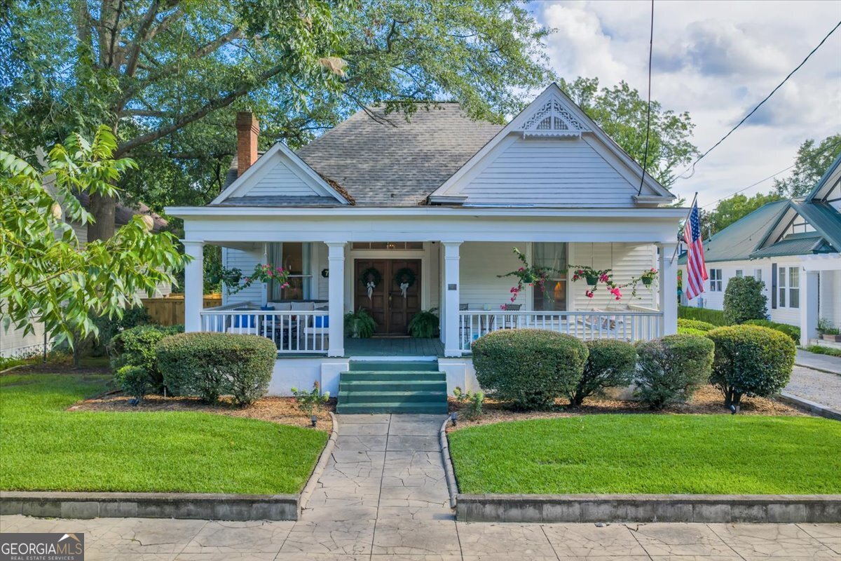 Step into timeless elegance at 712 Stonewall Street in Dublin, GA. This beautifully renovated historic home offers 5 spacious bedrooms, 3.5 bathrooms, and a versatile bonus room upstairs. From the moment you enter, you'll be captivated by soaring 12 foot ceilings, incredible molding, and refinished 118 year old heart pine floors that bring warmth and character to every room. The master suite features a luxurious clawfoot tub (one of two clawfoot tubs in the home), while two of the bedrooms showcase custom murals and hand-painted walls - true works of art that make this home one of a- kind. Large rooms throughout provide the perfect blend of historic charm and modern comfort. Enjoy outdoor living on the expansive front porch or the huge screened-in back patio, overlooking garden beds and a newly fenced backyard for added privacy. Updates to all major systems and a new roof mean peace of mind and easy move-in. Full of charm, character, and modern updates, this home is truly a rare find ready to welcome its next chapter!