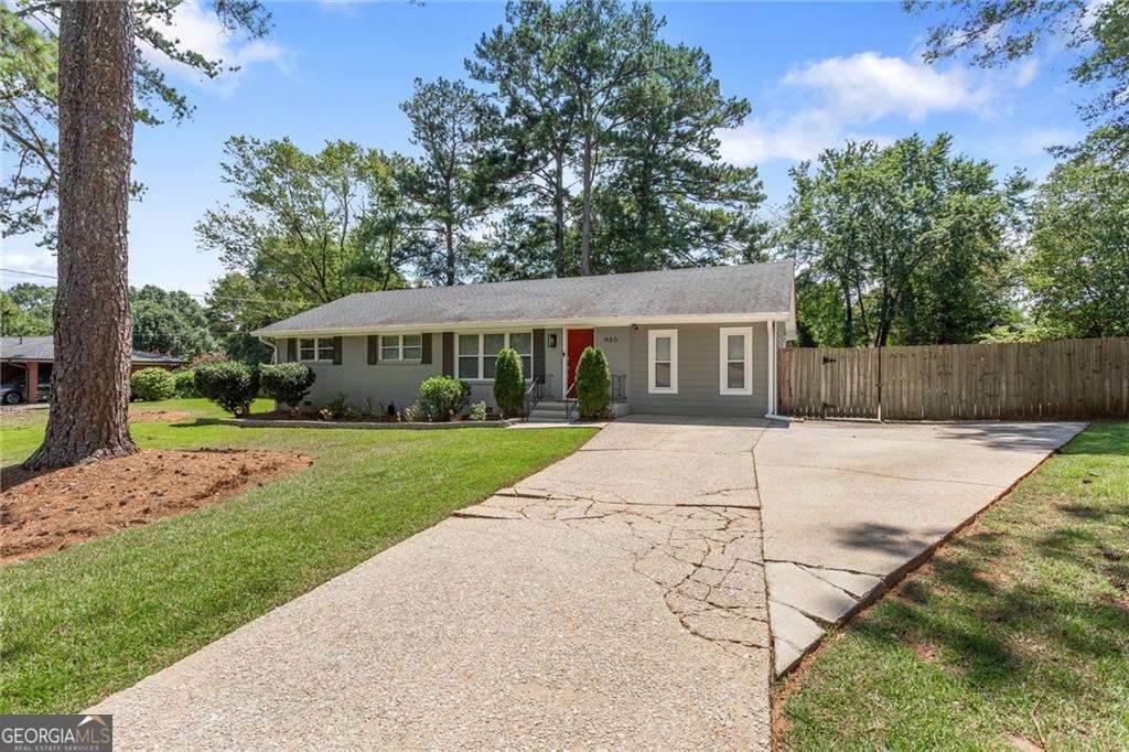 Welcome to 465 Plantation Road, a beautifully maintained home in the heart of Smyrna! This charming residence offers the perfect blend of comfort and convenience, featuring spacious living areas filled with natural light and a thoughtful layout ideal for both everyday living and entertaining. The kitchen provides plenty of cabinet space, modern appliances, and an open flow to the dining and living areas. You'll find generously sized bedrooms and updated bathrooms, creating a relaxing retreat for the whole family. Enjoy outdoor living in the private backyard, perfect for grilling, gardening, or simply unwinding. Located just minutes from The Battery, Truist Park, shopping, dining, and major highways, this home provides easy access to all that Smyrna and Atlanta have to offer. Don't miss your chance to rent this move-in ready home in one of Smyrna's most desirable locations!