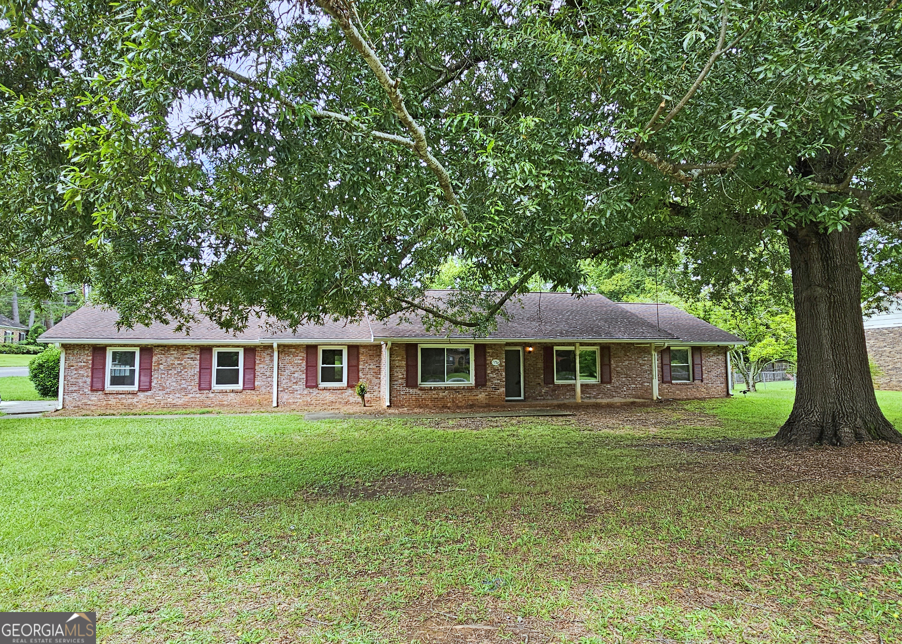 Welcome home to your private oasis. This beautiful wood and brick ranch home has beautiful finishes. This home has a great layout featuring three lovely bedrooms, two bathrooms an open kitchen a dining area, and a large living room. The property sits on a large lot with a detached structure in the backyard. Call Mr. Stephens at 770-595-4498 to see this incredible home today before it's gone!