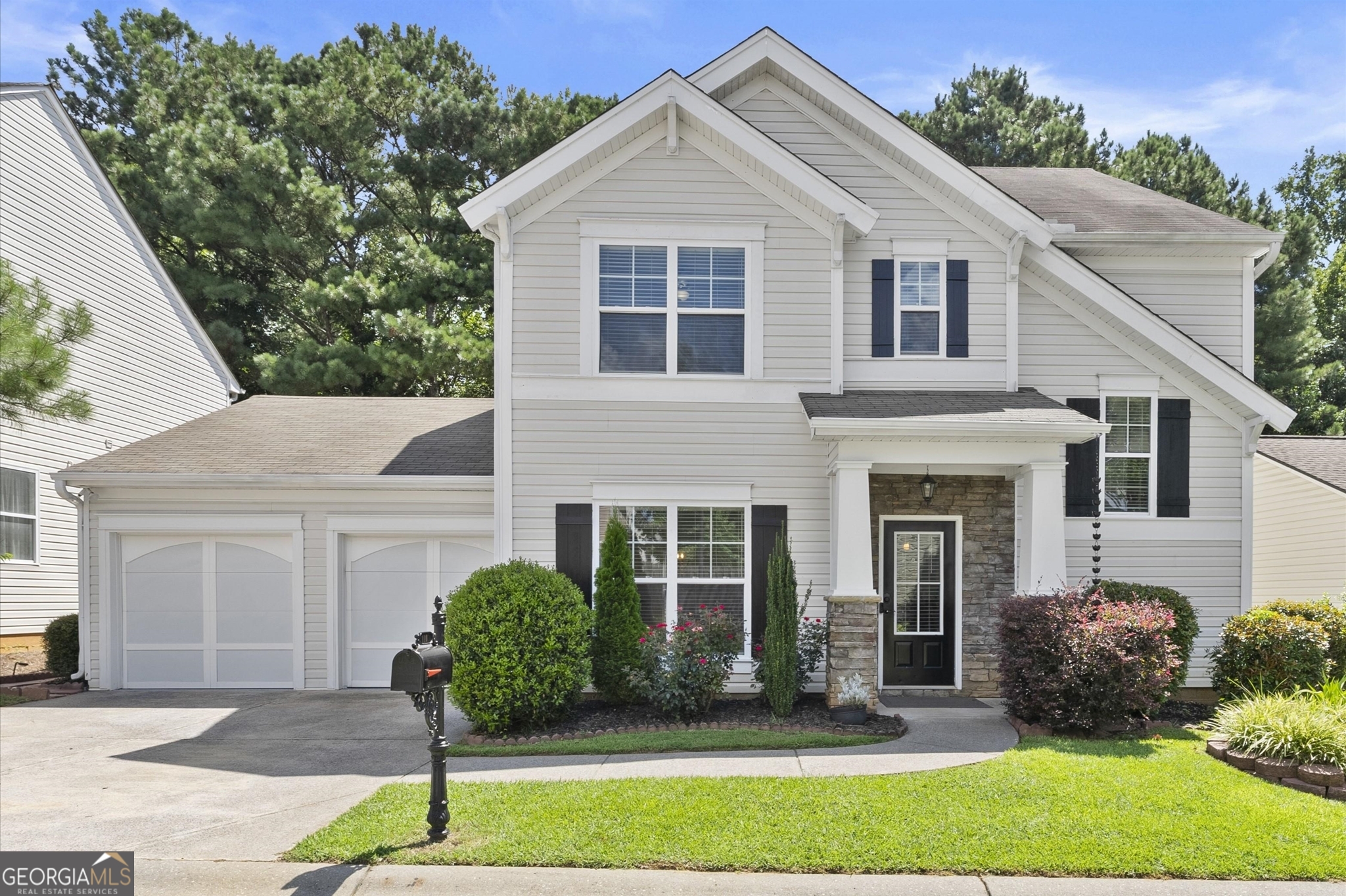 Fall in Love with this immaculate move-in ready home in Prominence Court! Welcome to one of the largest backyards in the highly sought-after Prominence Court community! This beautifully maintained home features an expansive outdoor space, perfect for entertaining or relaxing. Enjoy a covered porch with a built-in bar and wall-mounted TV, an extended concrete patio with a stunning 10x10 metal gazebo, a fire pit, a storage shed, and mature landscaping that completes this inviting outdoor oasis. Inside, the home is filled with thoughtful upgrades and stylish touches, including elegant light fixtures, wood plank accent walls, tasteful wallpaper, and fresh interior paint throughout. The spacious kitchen offers both electric and gas connections for the range, ample room for a breakfast table, and a separate formal dining room for special gatherings. The family room is warm and inviting, centered around a floor-to-ceiling shiplap-framed fireplace, with a generous layout and views of the backyard. The main level also includes a convenient laundry room and a half bath. Upstairs, you'll find three bedrooms, two full bathrooms, and a cozy sitting area-ideal for reading or relaxing. The luxurious owner's suite is a true retreat, featuring a spa-like ensuite bathroom with a separate garden tub, a large walk-in shower, and double vanities. Perfectly located just minutes from shopping, top-rated schools, I-575, and only 5 miles from vibrant Downtown Woodstock. This is a home you don't want to miss!