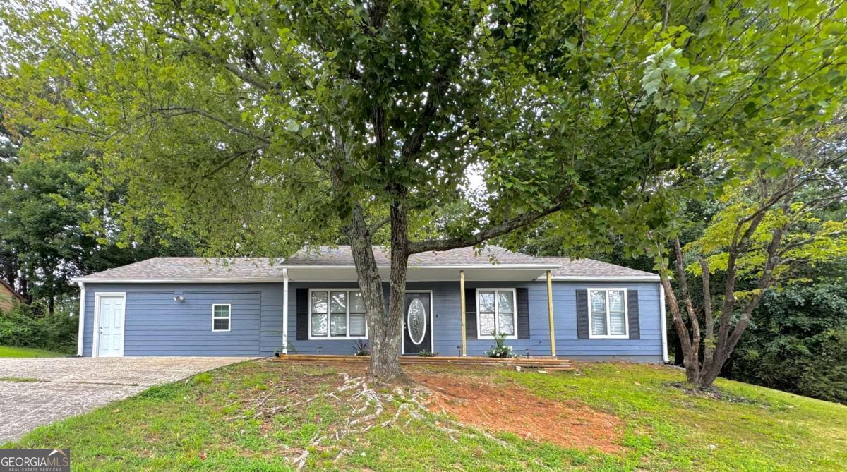 Beautiful ranch-style home featuring 4 bedrooms and 3 full bathrooms, perfectly located in Woodstock, GA. Recently updated with a modern kitchen, brand-new flooring, fresh paint throughout, and a new roof. Spacious, bright, and move-in ready, this home offers both comfort and style on a quiet street. Just minutes from Kroger, Walmart, Dollar Tree, local shops, and dining. Also conveniently close to top-rated schools, parks, and Woodstock's vibrant downtown. A must-see opportunity with everything you need nearby! Schedule your showing TODAY!! Motivated Seller.