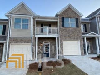 Beautiful Kendall floorplan!! This 2-bedroom townhome has an open floorplan and comes equipped with two large master suites. Stainless-steel appliances are also included. Luxury vinyl tile on the entire 1st floor is also included. The master bathroom is open and airy and features very nice tile work. Community is close to shopping, golf, and the highway. Why rent when you can enjoy high class maintenance free living!!! This beautiful townhome will be all brick as well!!! Pictures are stock photos of the actual floorplan. Townhome will be ready July 2022!!