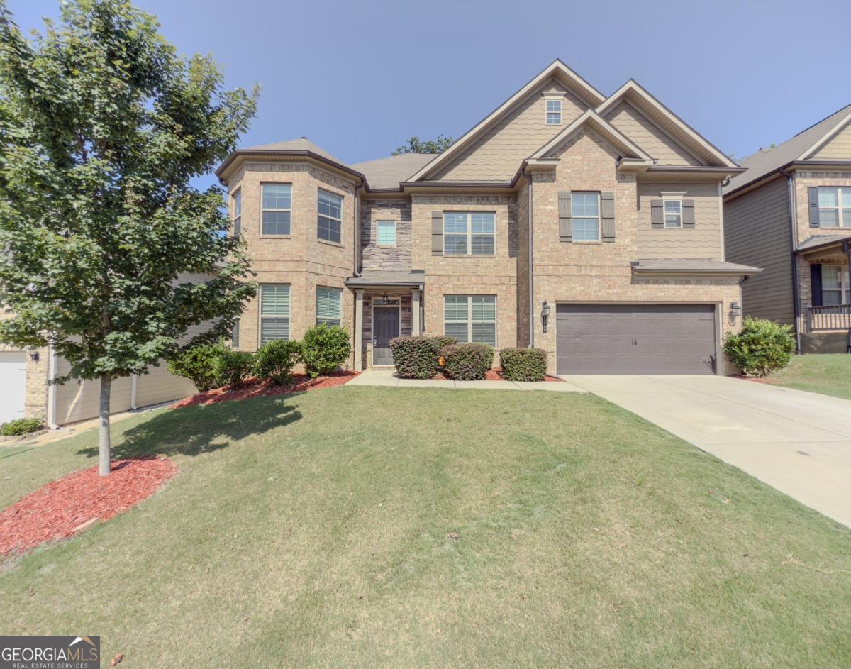 Awesome looking Brick Front home w. Double Bay Turrets & Large Covered Rear Back Patio in sought after Mill Creek School district! Reynolds plan has 6 bedrooms & 4 Full Baths! Guest bedroom & full bath downstairs. Master Bath has Tile Shower and Tiled Drop-in Tub! Hardwood floors 1st floor main areas! Gourmet Kitchen w. Espresso cabinets / stainless steel appliances w. double ovens & side-by-side refrigerator. Olympic sized swimming pool & clubhouse. Only 1 mile from Interstate I-85. GOOD RENTAL HISTORY- 2 RENTAL REFERENCES-AND CREDIT CHECK IS REQUIRED