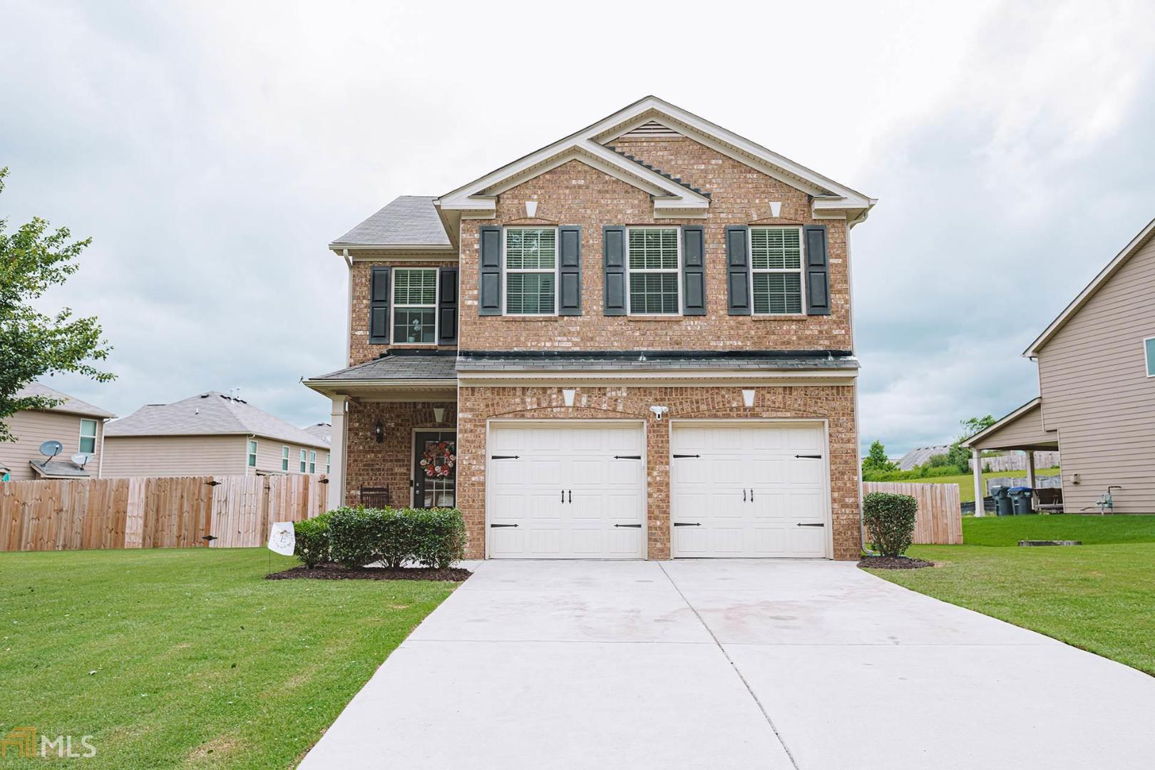 Beautiful, like-new home in Villages at Settingdown Creek! This meticulously maintained 4 bedroom 2.5 bathroom home features hardwoods on the main floor, granite countertops in the kitchen, and a fireplace in the family room. A covered back patio overlooks the spacious, level backyard. Trey ceilings in 3 bedrooms and a vaulted ceiling in the fourth! New garage door opener. All of this in a wonderful, family-oriented swim/tennis neighborhood with a newly installed community playground! Great location close to 400 and Forsyth County schools!!