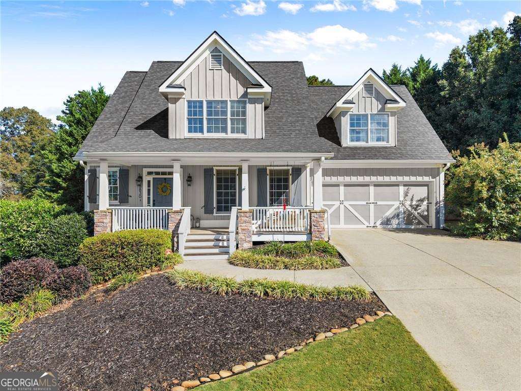 Discover the perfect blend of space, style and ultimate convenience in this stunning 5-bedroom, 3.5-bathroom home, nestled on a private, fenced half-acre lot. From the moment you step inside, you'll be captivated by the sun-drenched, open-concept layout. The soaring vaulted ceilings in the family room create a sense of grandeur, while shiplap accent walls and gleaming hardwood floors add a touch of modern farmhouse charm. The heart of the home is the beautiful kitchen, featuring modern appliances that flows effortlessly into the great room. Picture yourself cozying up by the fireplace on cool evenings or hosting memorable gatherings with friends and family. Upstairs, three additional spacious bedrooms share a convenient Jack & Jill bathroom, providing plenty of space for family and guests. The finished terrace level offers incredible flexibility-a private guest suite with a bedroom and full bath, plus a versatile flex space perfect for a home theater, gym, or remote office. Your living space extends outdoors to an oversized back deck, the ideal spot for summer barbecues and relaxing afternoons overlooking your peaceful, fully-fenced backyard. Situated in a prime location near top-rated Forsyth County schools, this home offers unparalleled access to the best of the area. Enjoy effortless shopping sprees and find your favorite brands at the North Georgia Premium Outlets along with a world of dining, entertainment, and everyday conveniences, all within a short drive! This home is the complete package. Schedule your private tour today and prepare to fall in love!