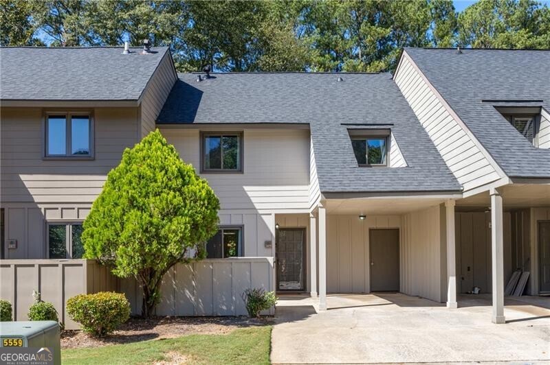 Welcome home to Cedar Canyon- a beautiful swim and tennis community surrounded by lush landscape, ideally situated within minutes of The Battery and I-75. This recently renovated unit includes two levels of light-filled space overlooking an expansive private greenspace. On the main floor, a spacious, updated kitchen is flanked by a private home office and a separate dining room which opens into the airy, two-story great room. An architectural niche allows for the perfect dropzone and even a bar and a separate powder room is perfect for guests. Upstairs, the open loft accomodates a convenient laundry room and a second work from home space (or the perfect place for a Peloton). The primary suite features vaulted ceilings, a walk-in shower and a new vanity. The two ample secondary bedrooms each with private closet share a large hall bathroom.